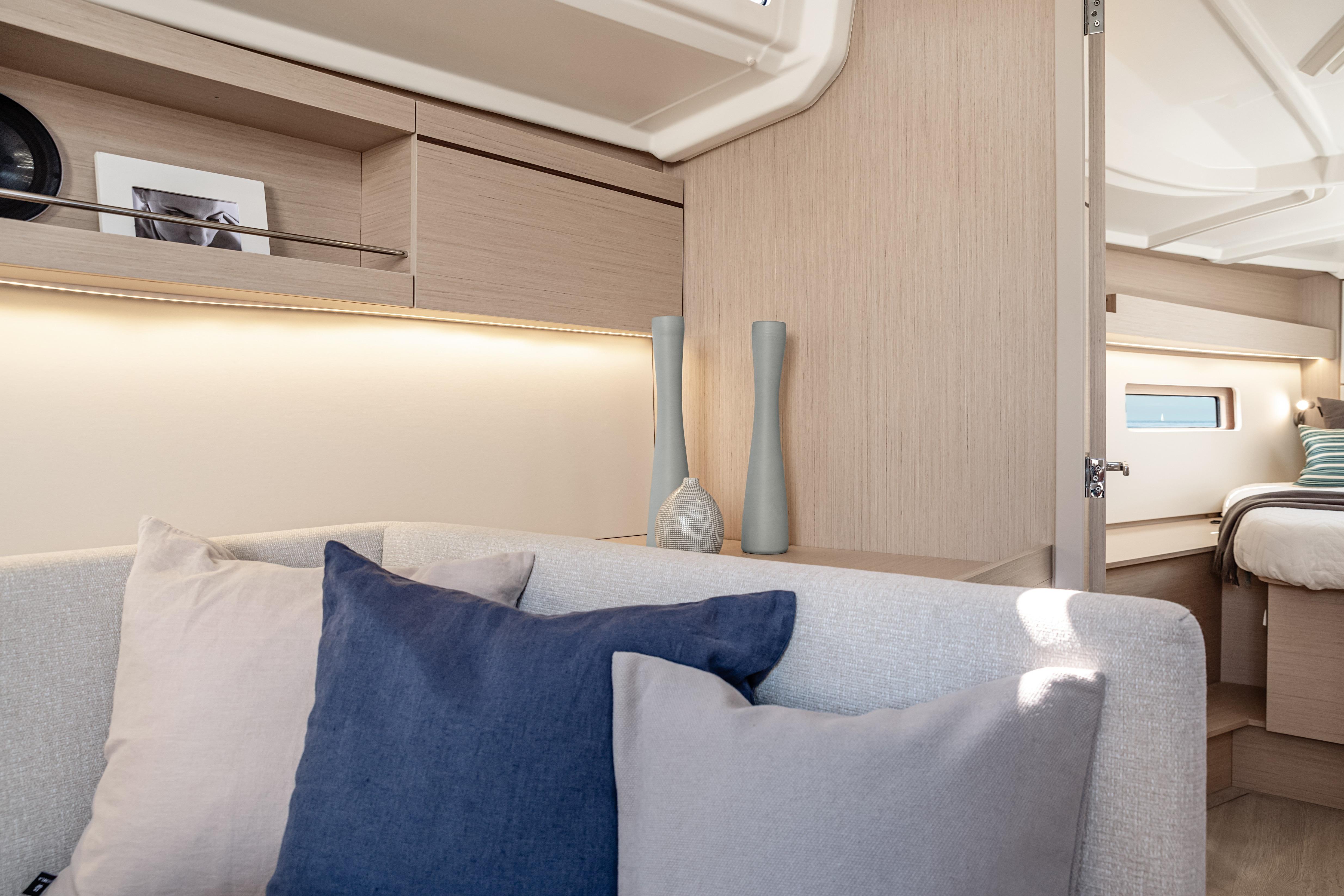 Luxurious interior of 2026 Beneteau Oceanis 40.1 yacht with elegant decor and cozy seating.