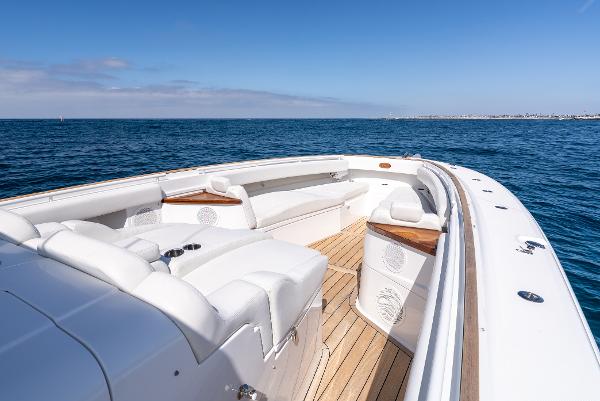 2020 HCB 53 Sueños luxury boat on open sea, featuring spacious deck seating.