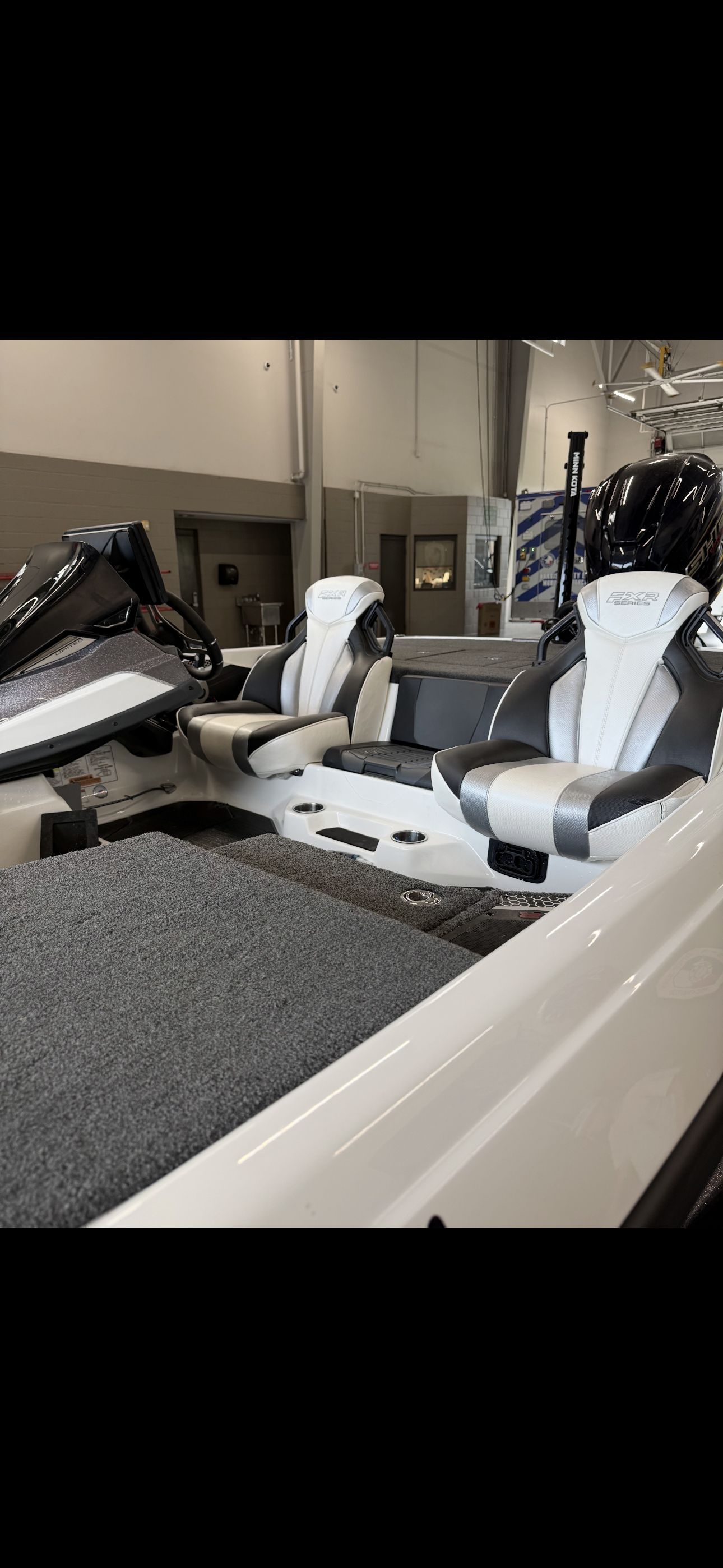 Interior view of a 2022 Skeeter FXR20 Limited with modern seats and console.