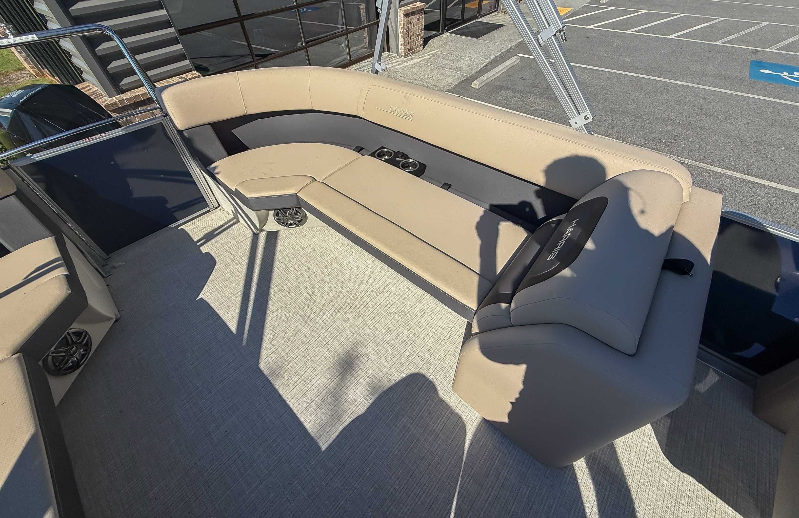 Interior of 2025 Harris Cruiser 250 CWDH with beige seating.