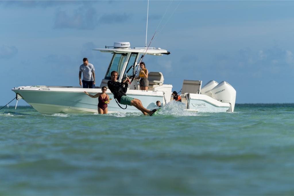 People enjoying water activities near a 2024 Boston Whaler 280 Dauntless boat.