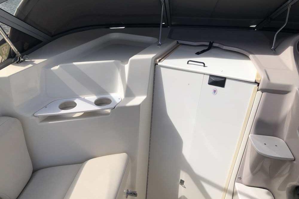 Interior of 1999 Regal Commodore 2760 boat with seating and storage.