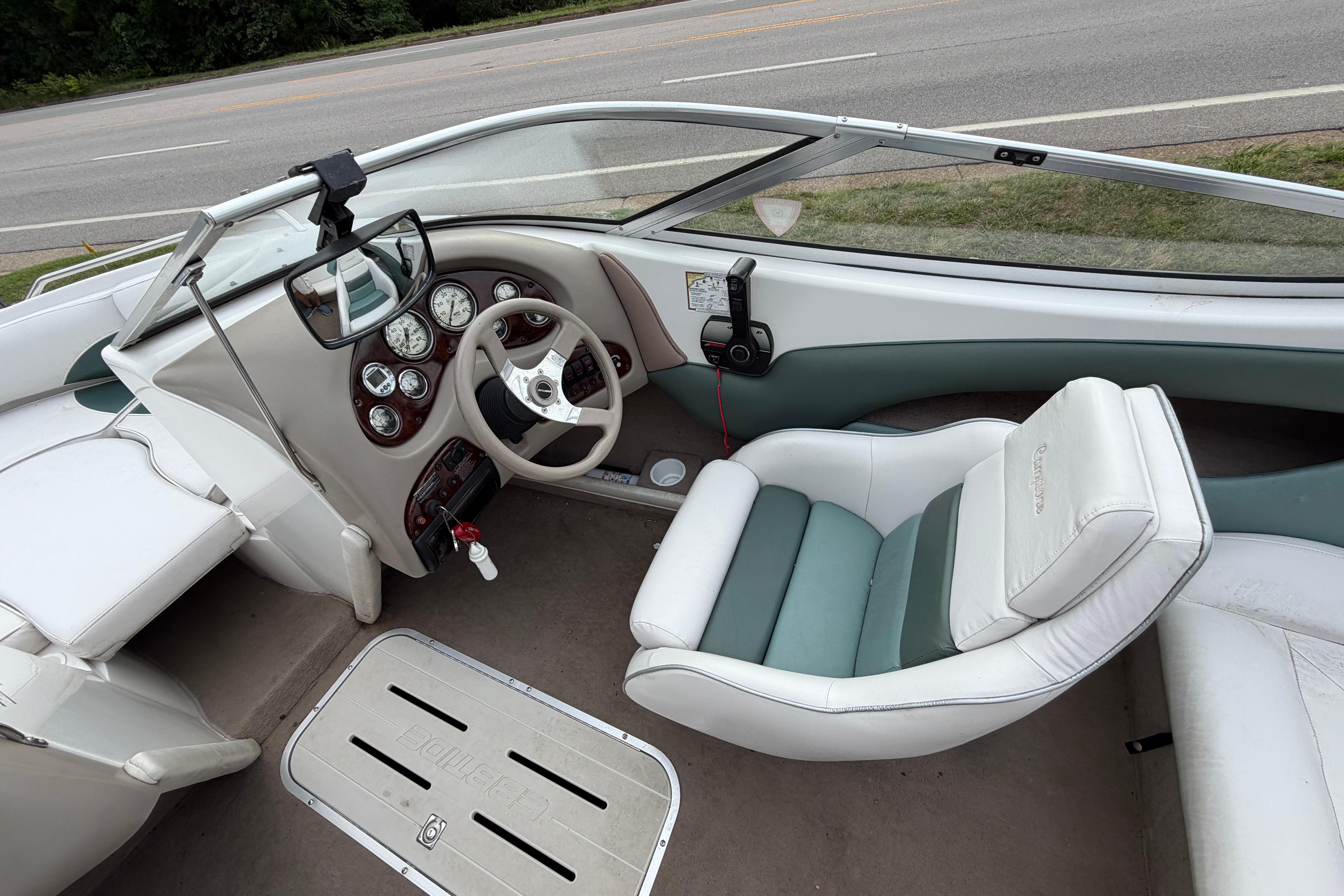 2001 Ebbtide Campione 190 boat interior with steering wheel and dashboard controls.