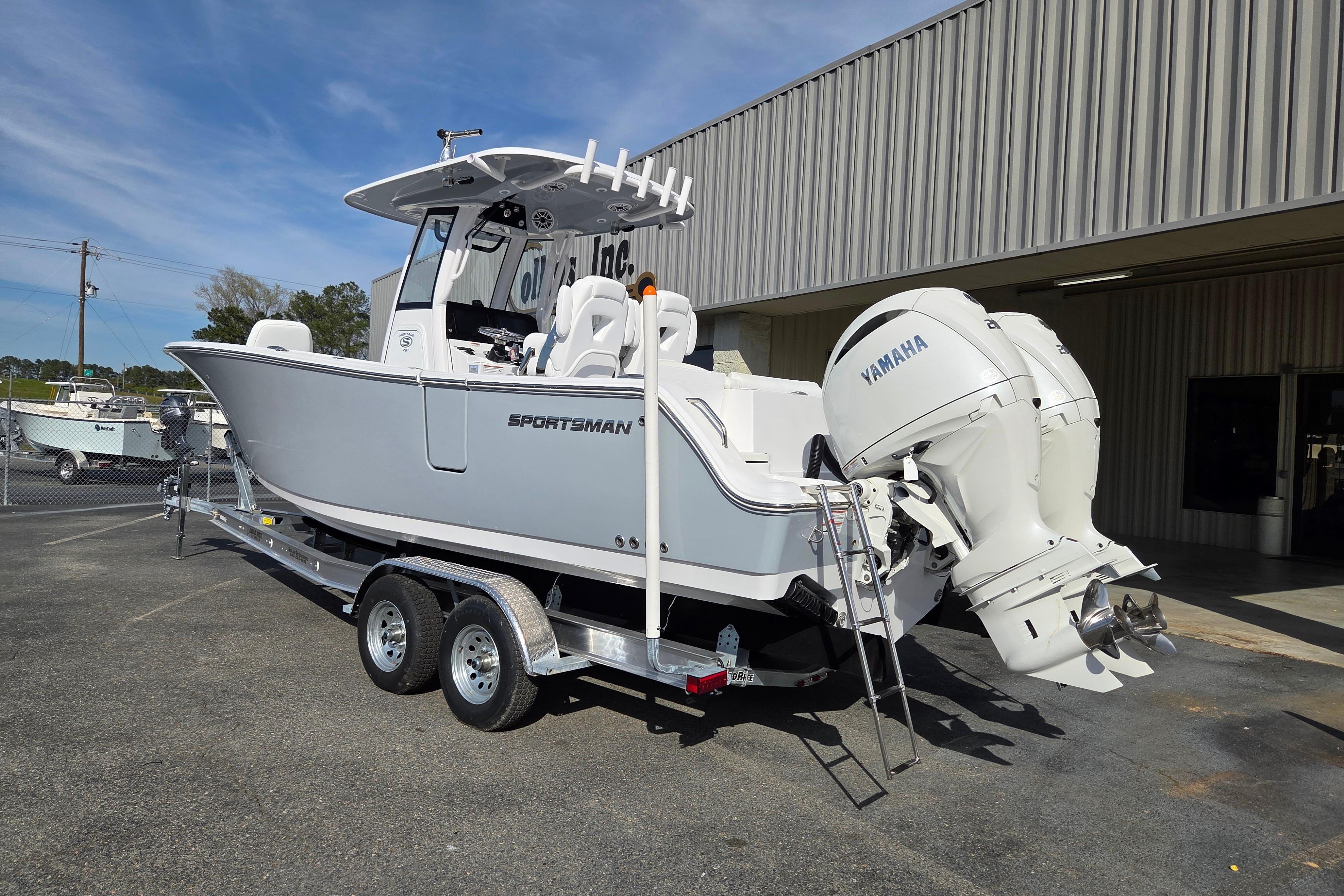 2026 Sportsman Heritage 261 Center Console boat with Yamaha engines on a trailer.