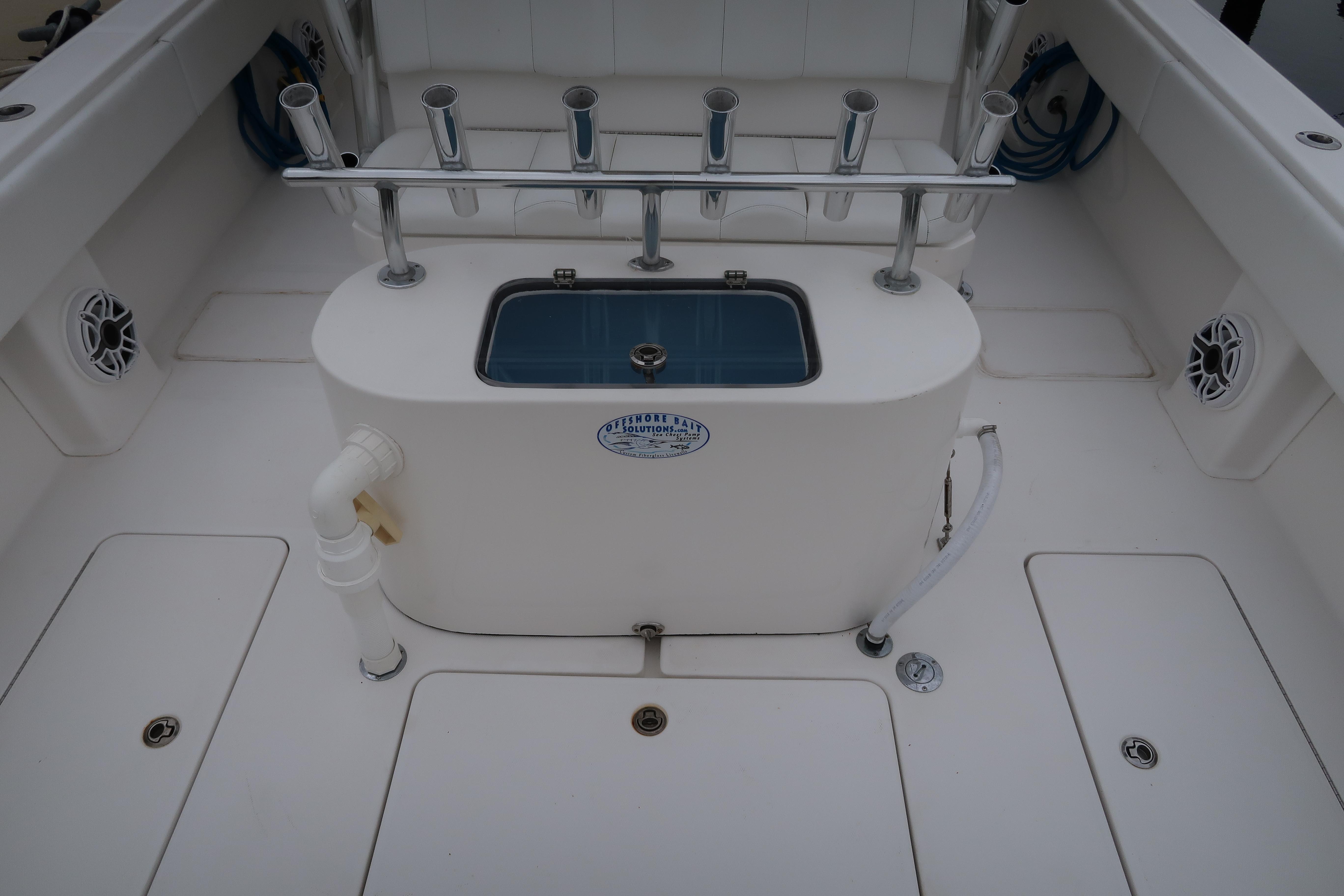 2016 Invincible 42 Open Fisherman boat deck with rod holders and livewell.