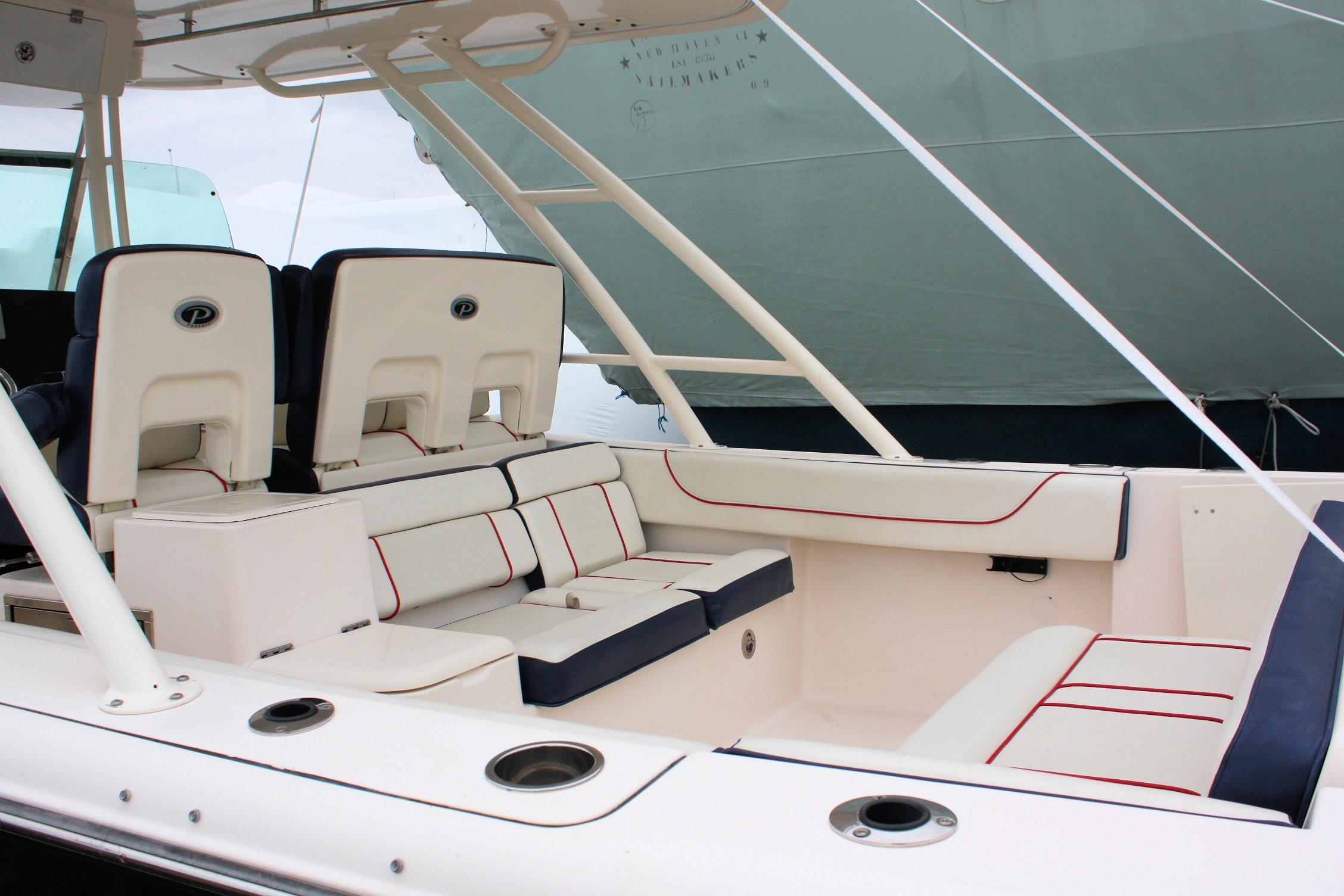 2013 Pursuit ST 310 Sport boat interior with white and navy seating.