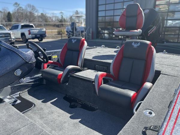 2025 Phoenix 920 Elite boat interior with red and black seats, steering wheel, and console.