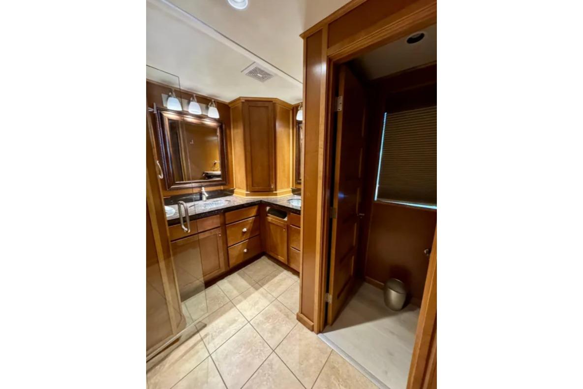 Luxurious wooden bathroom interior in 2012 Bravada Helios Share #8 RV.
