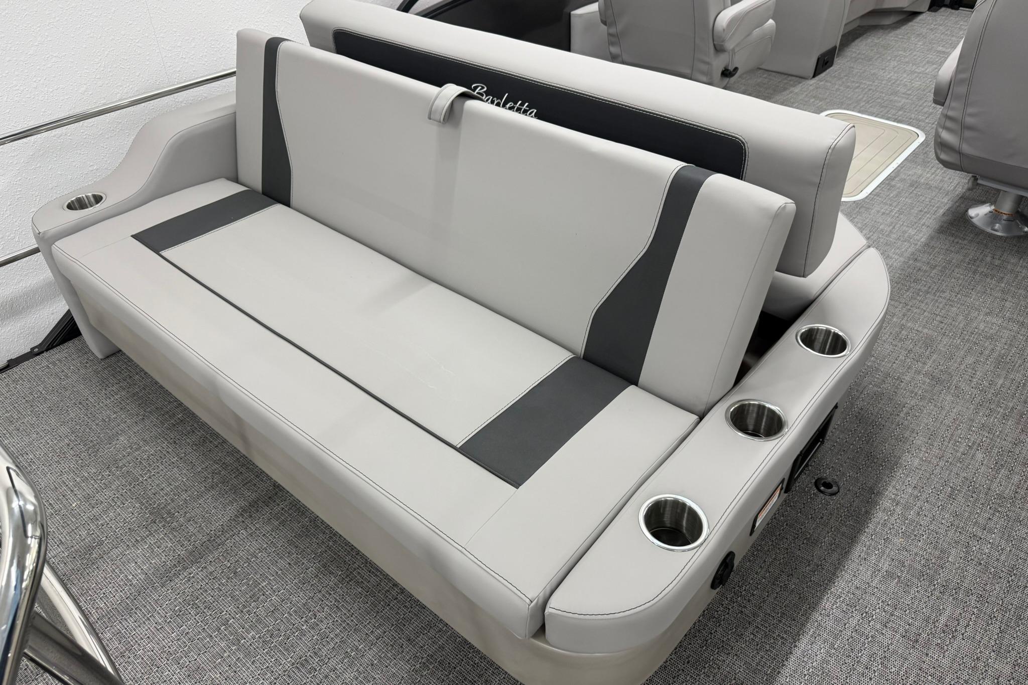 Luxurious seating on 2026 Barletta ARIA 22UC boat with integrated cup holders.