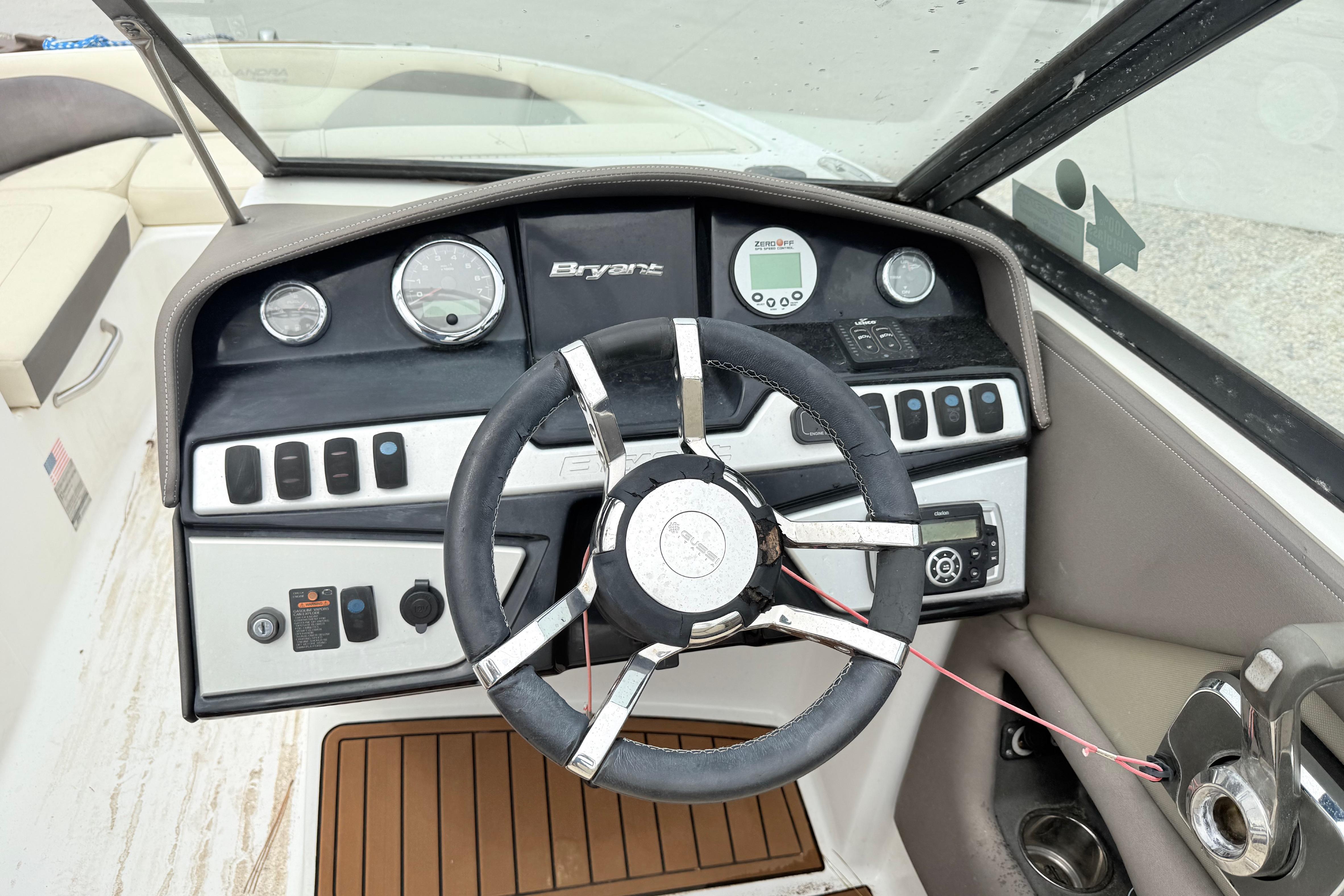 Steering console of a 2018 Bryant Calandra boat with gauges and controls.