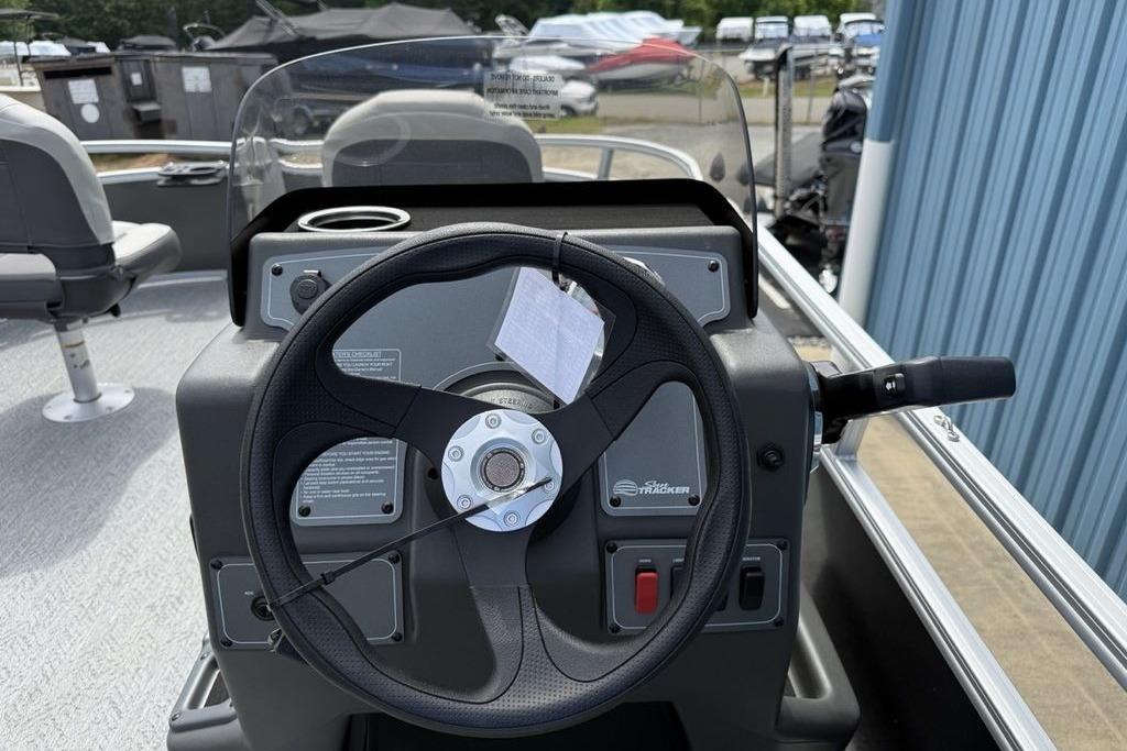 Steering console of 2026 Sun Tracker Bass Buggy 16 XL Select pontoon boat.