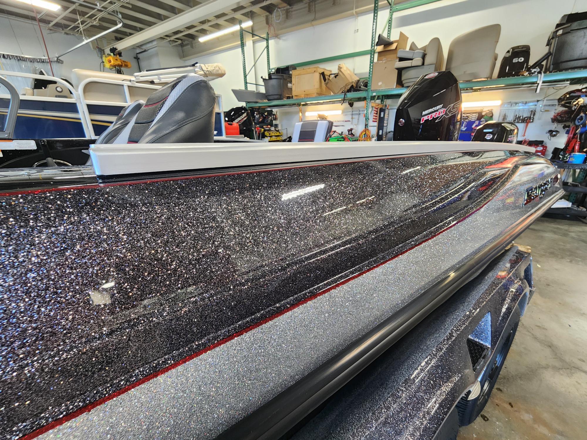 2025 Ranger 1880MS boat with glittery finish in a showroom.