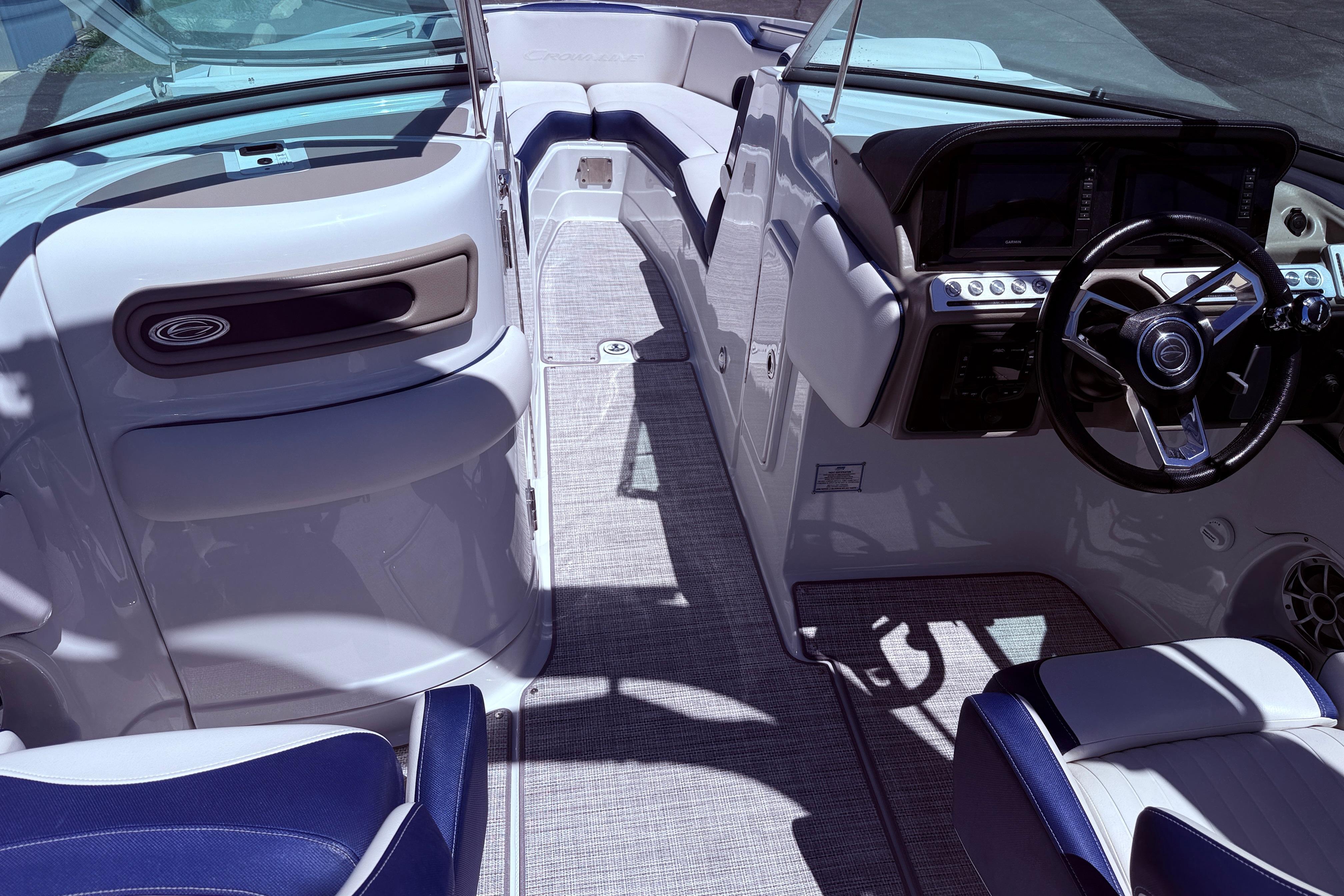 2025 Crownline 290 XSS boat interior with modern dashboard and seating.