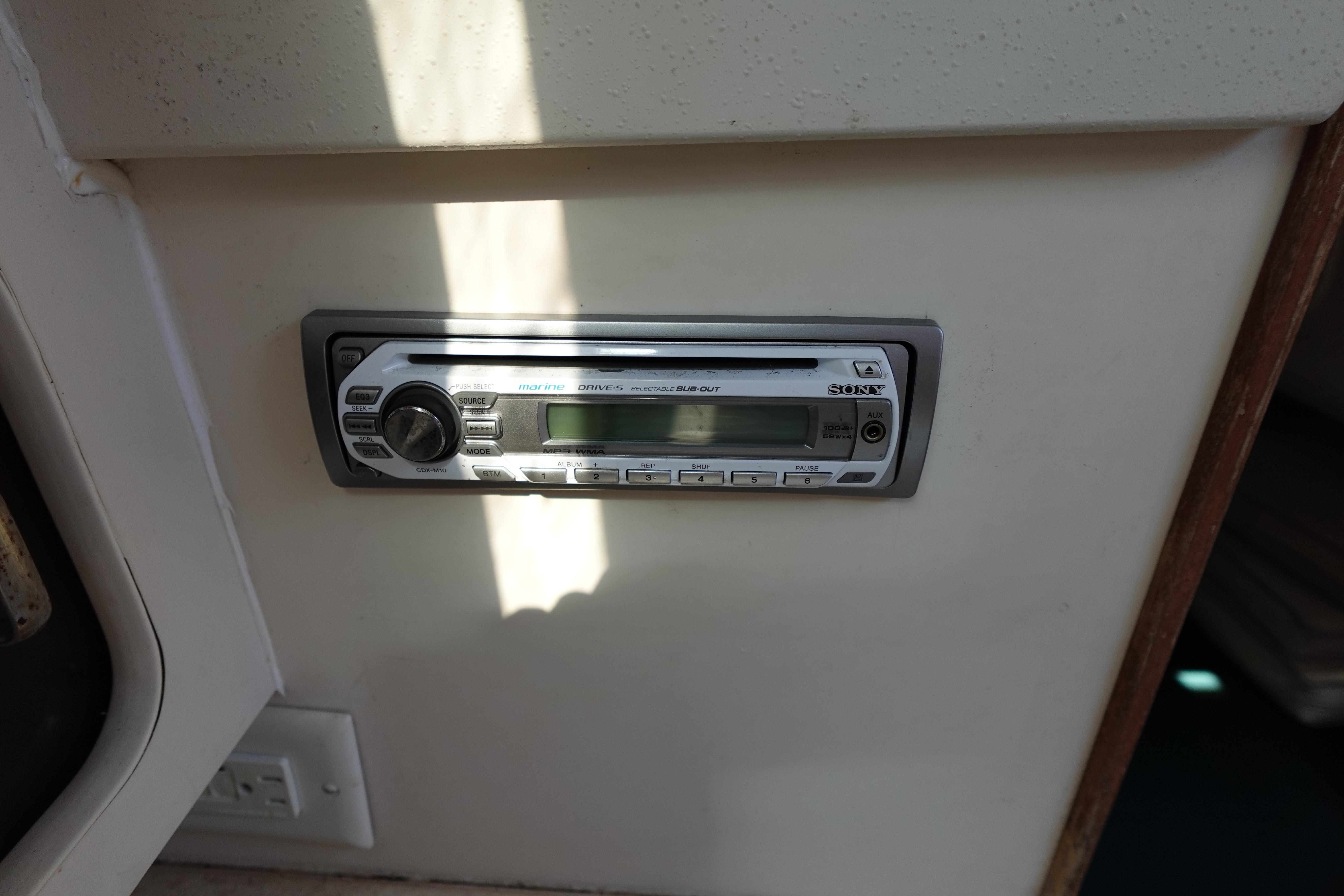 1997 Catalina 28 interior with a Sony car stereo installed on a white panel.