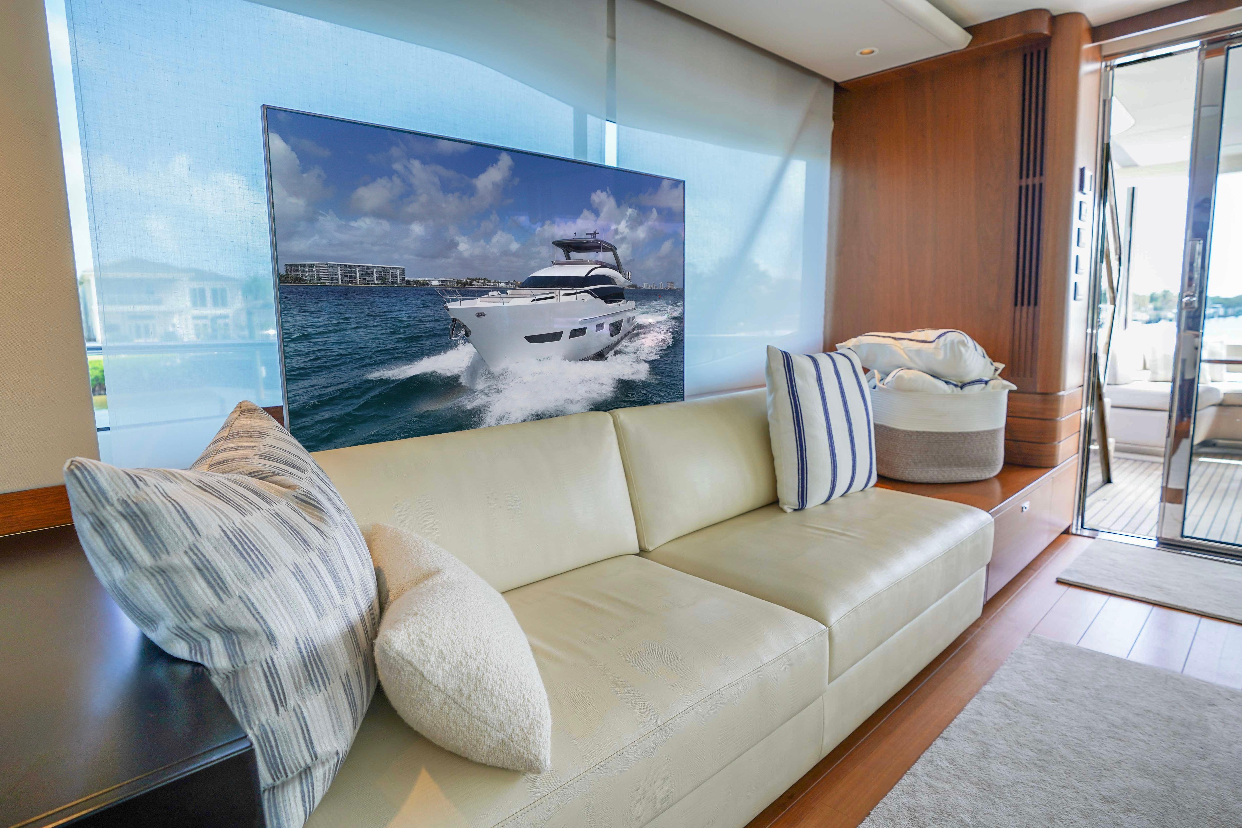 Luxurious interior of 2021 Princess Y85 yacht with comfortable seating and elegant decor.