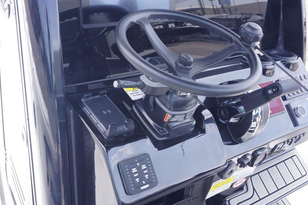 Steering console of 2027 Tidewater 2500 Carolina Bay boat with modern controls.
