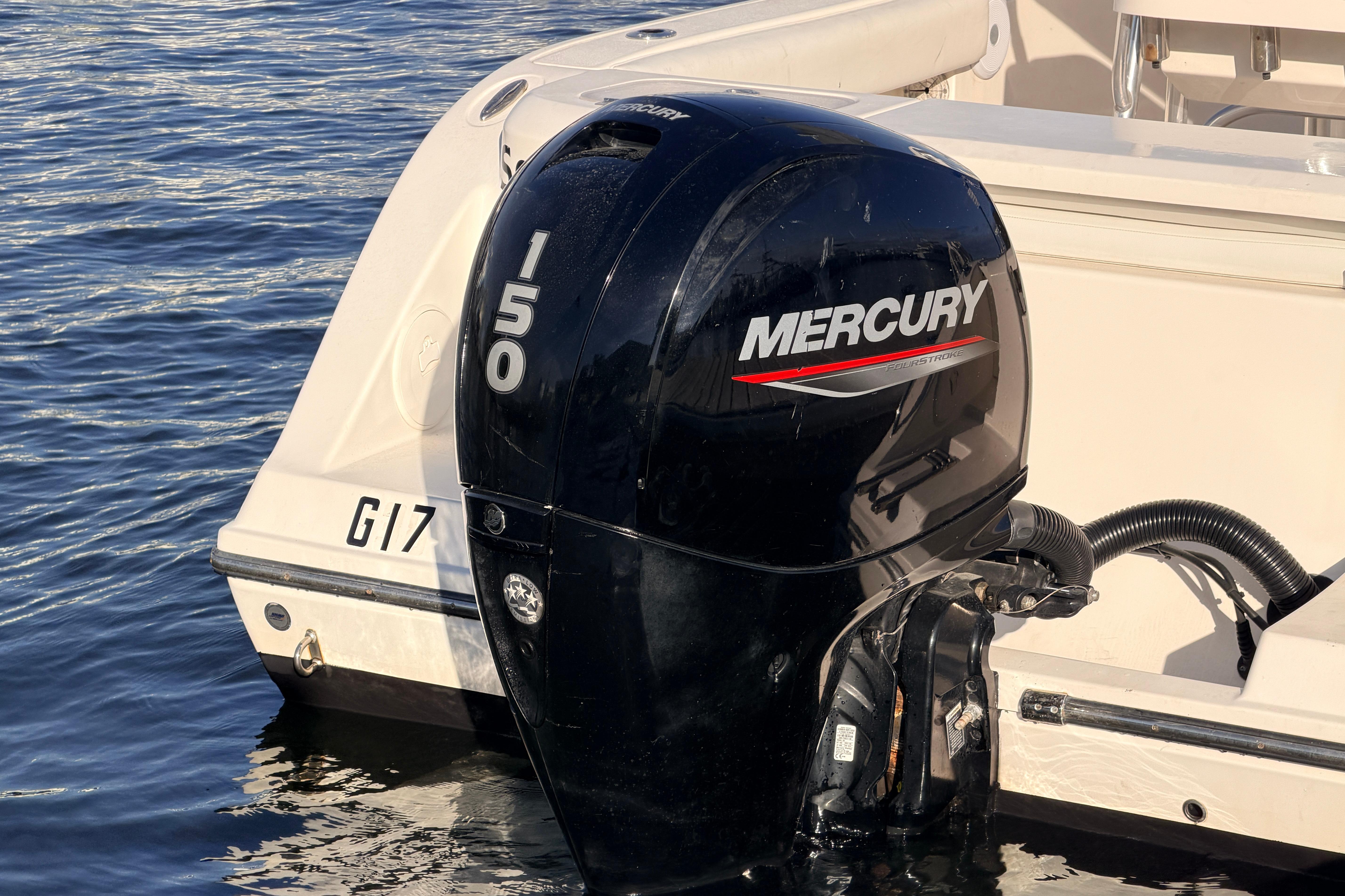 2020 Cobia 220 Center Console with Mercury 150 outboard engine on water.