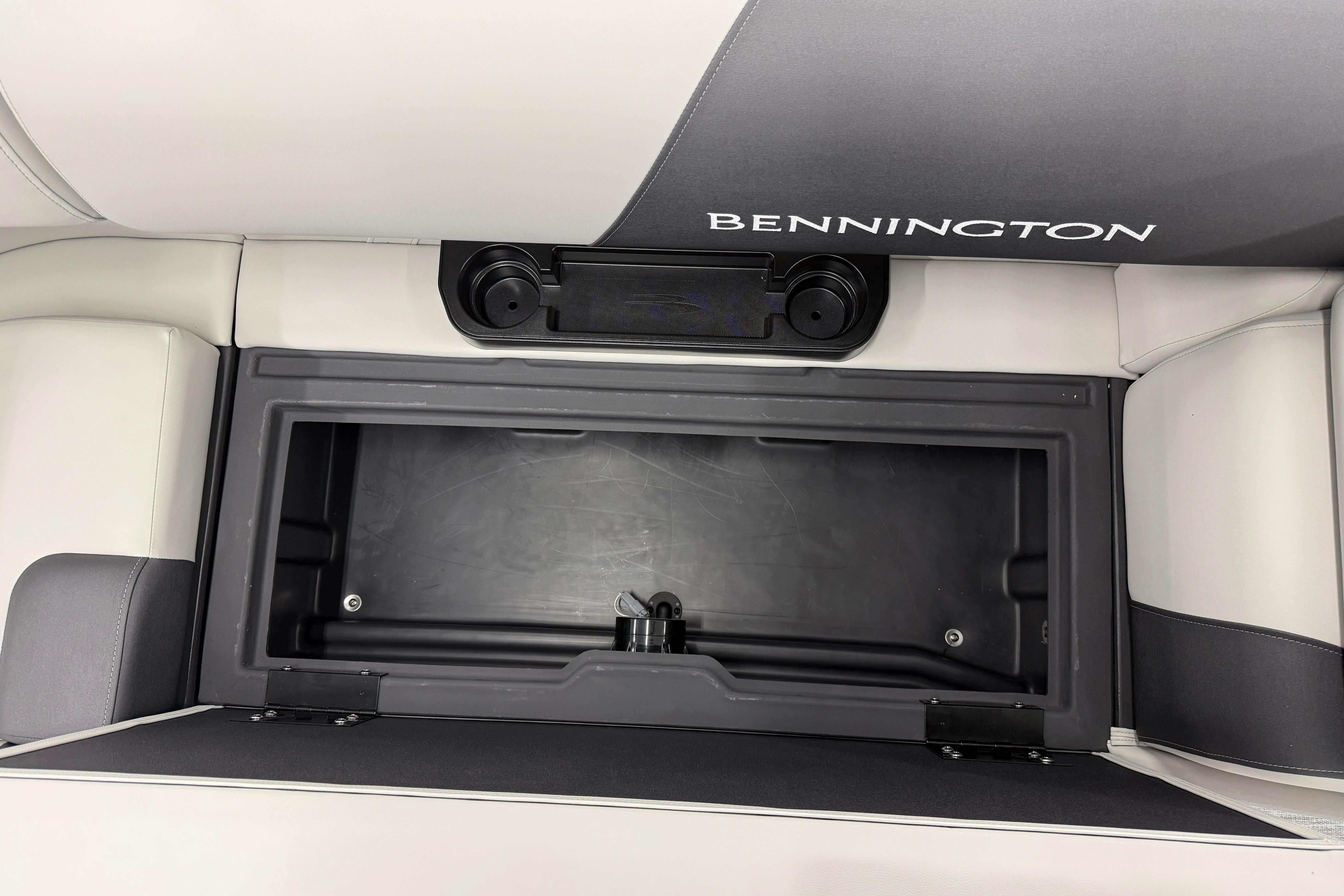 2026 Bennington 20 SF boat storage compartment with sleek design and integrated cup holders.