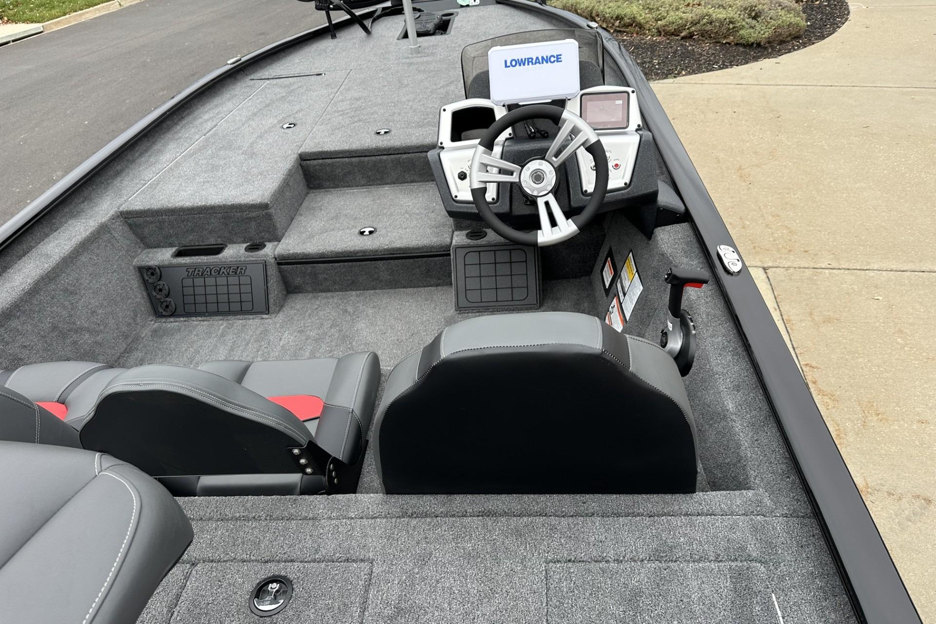2025 Tracker Savage 215 boat interior with steering wheel and seating.