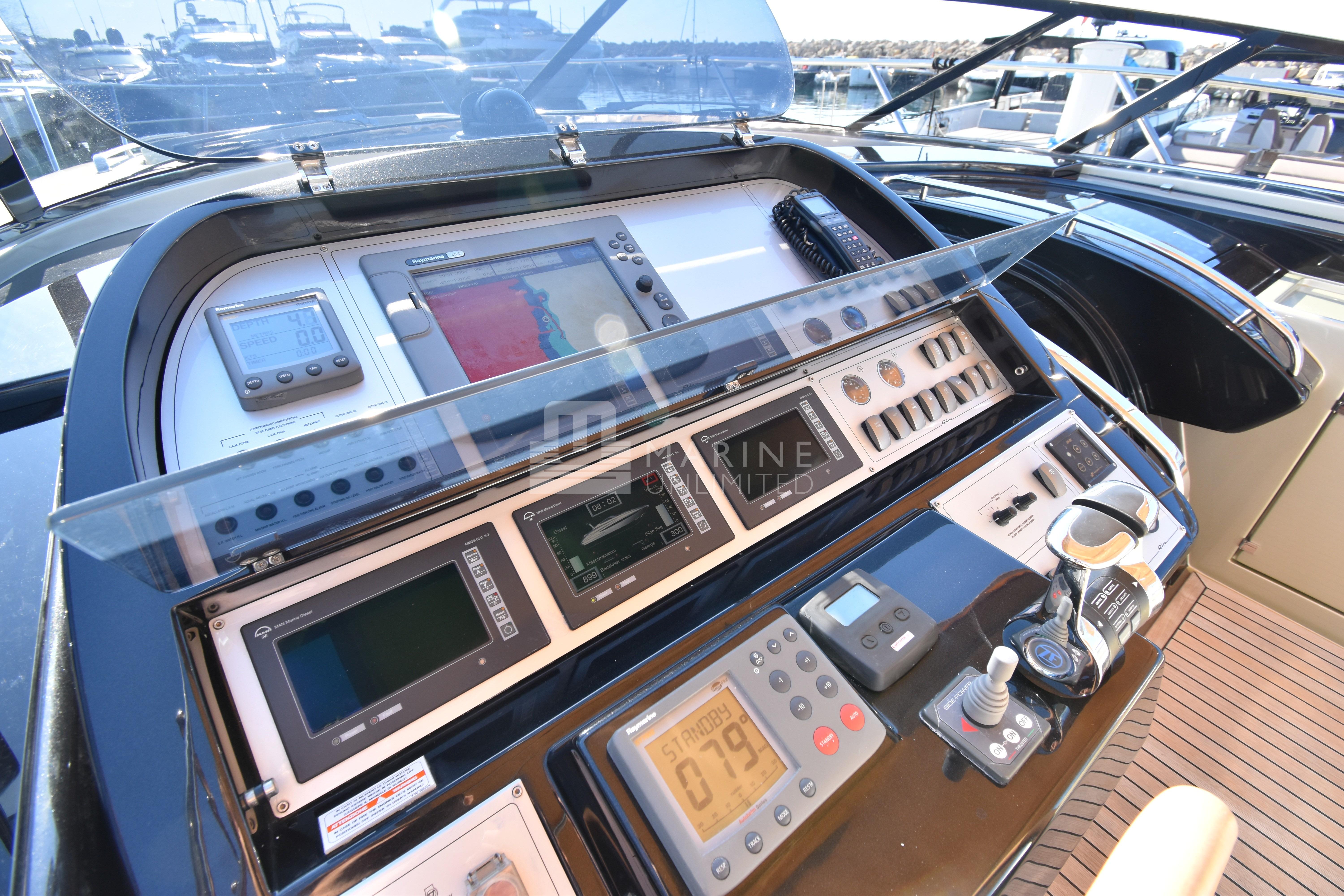 Cockpit controls of a 2010 Riva 52' Rivale yacht, featuring advanced navigation systems.