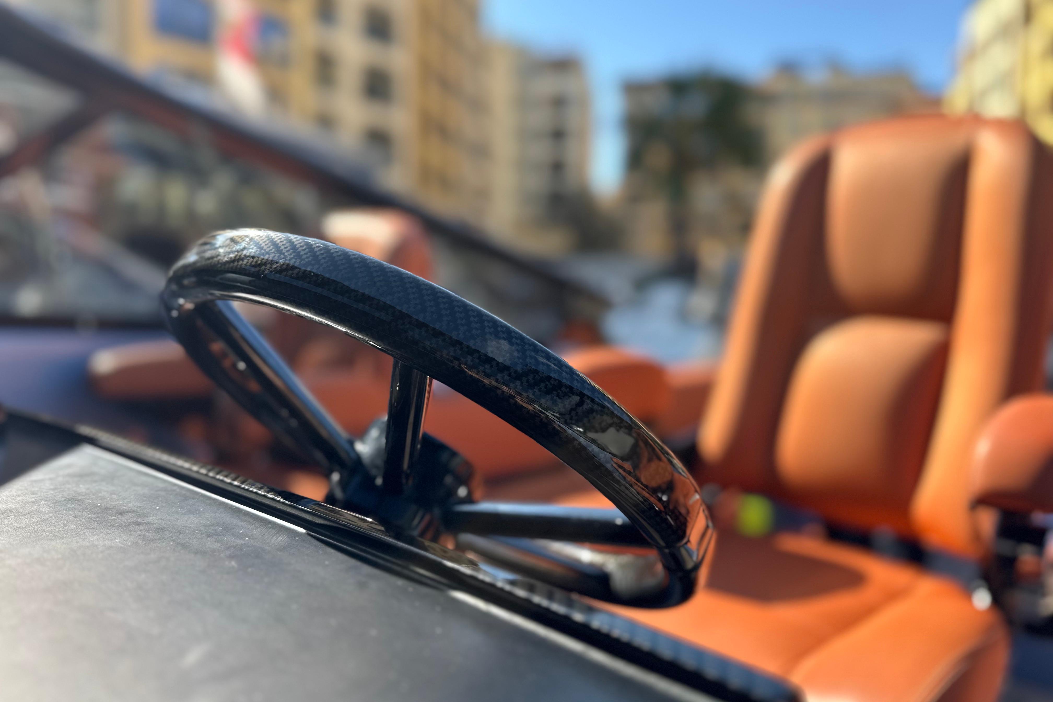 Steering wheel and seat of 2014 Wajer 38 boat, showcasing luxury design.