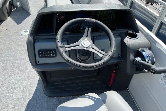 Steering console of 2026 Sun Tracker Party Barge 22 DLX pontoon boat.