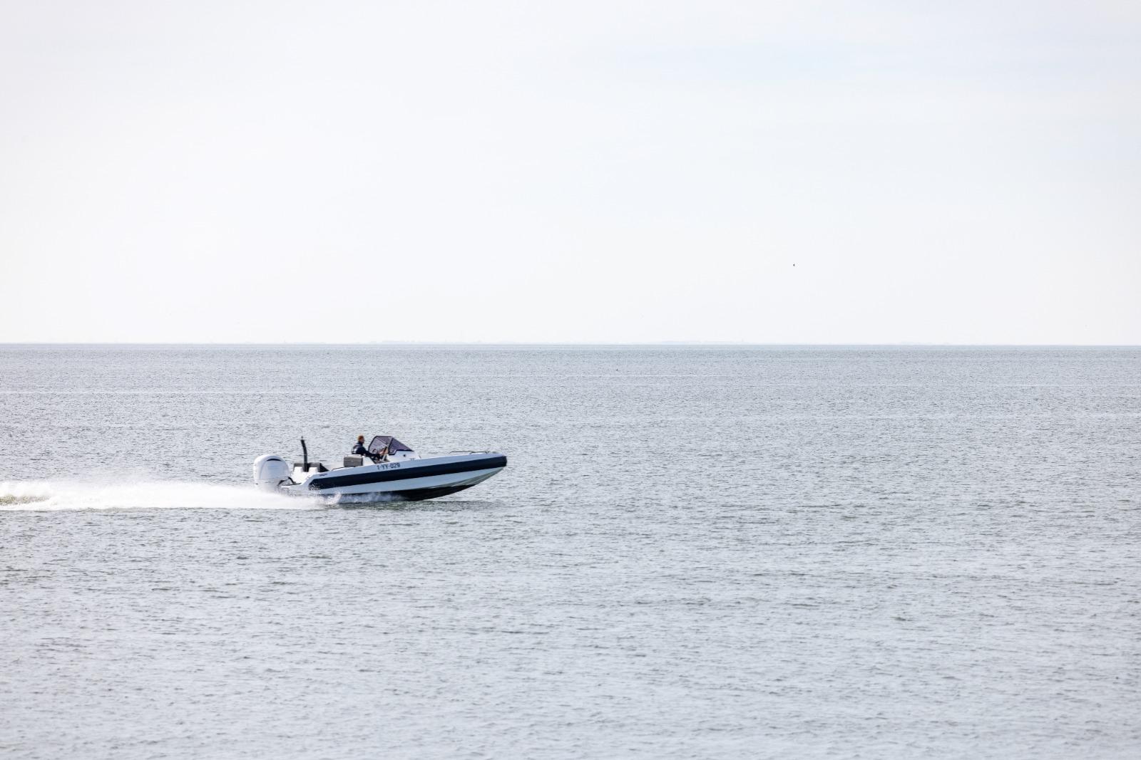 Speedboat Iron 707 cruising on open water, 2022 model.