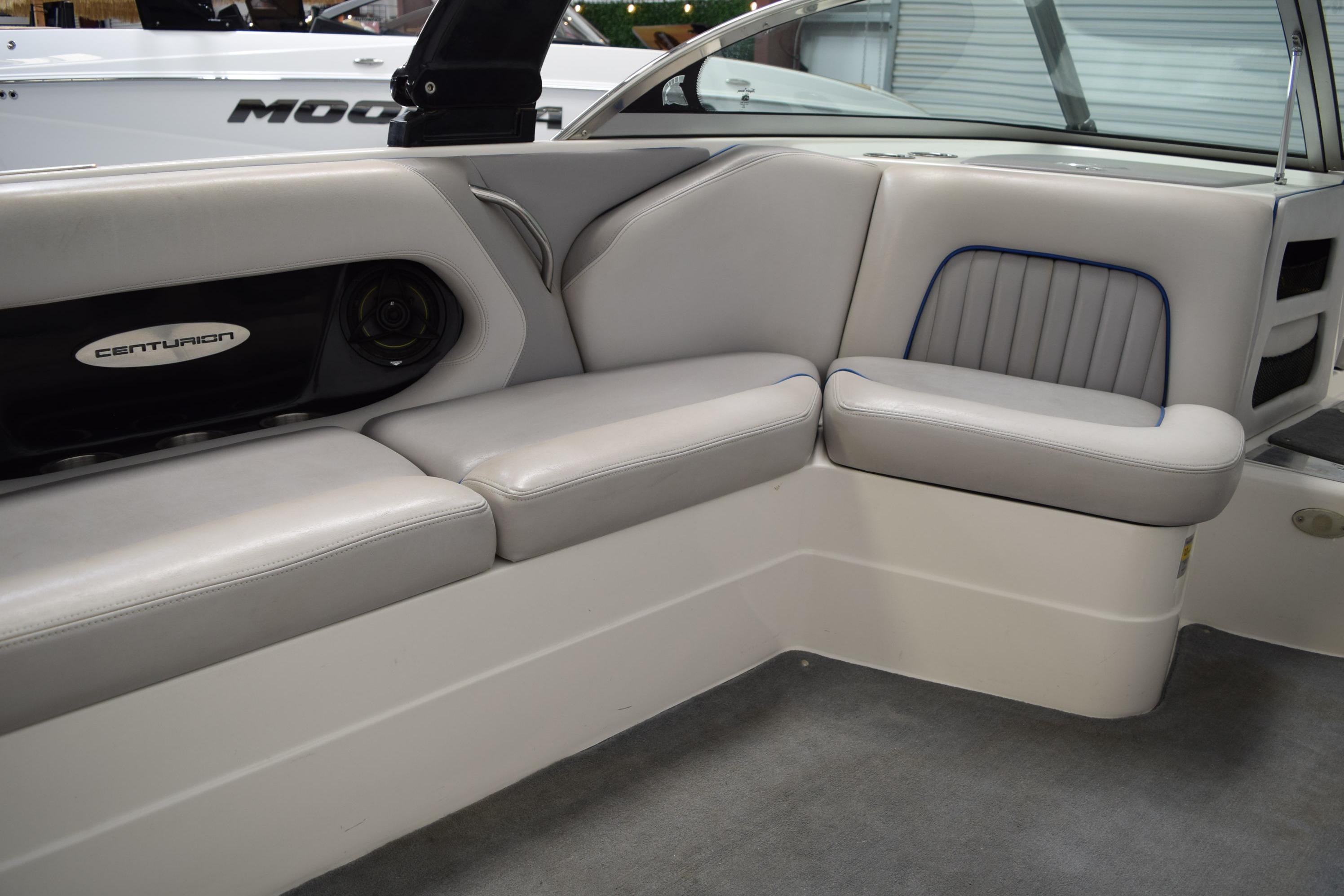 Interior of a 2007 Centurion SV 240 boat with gray seating and speaker system.