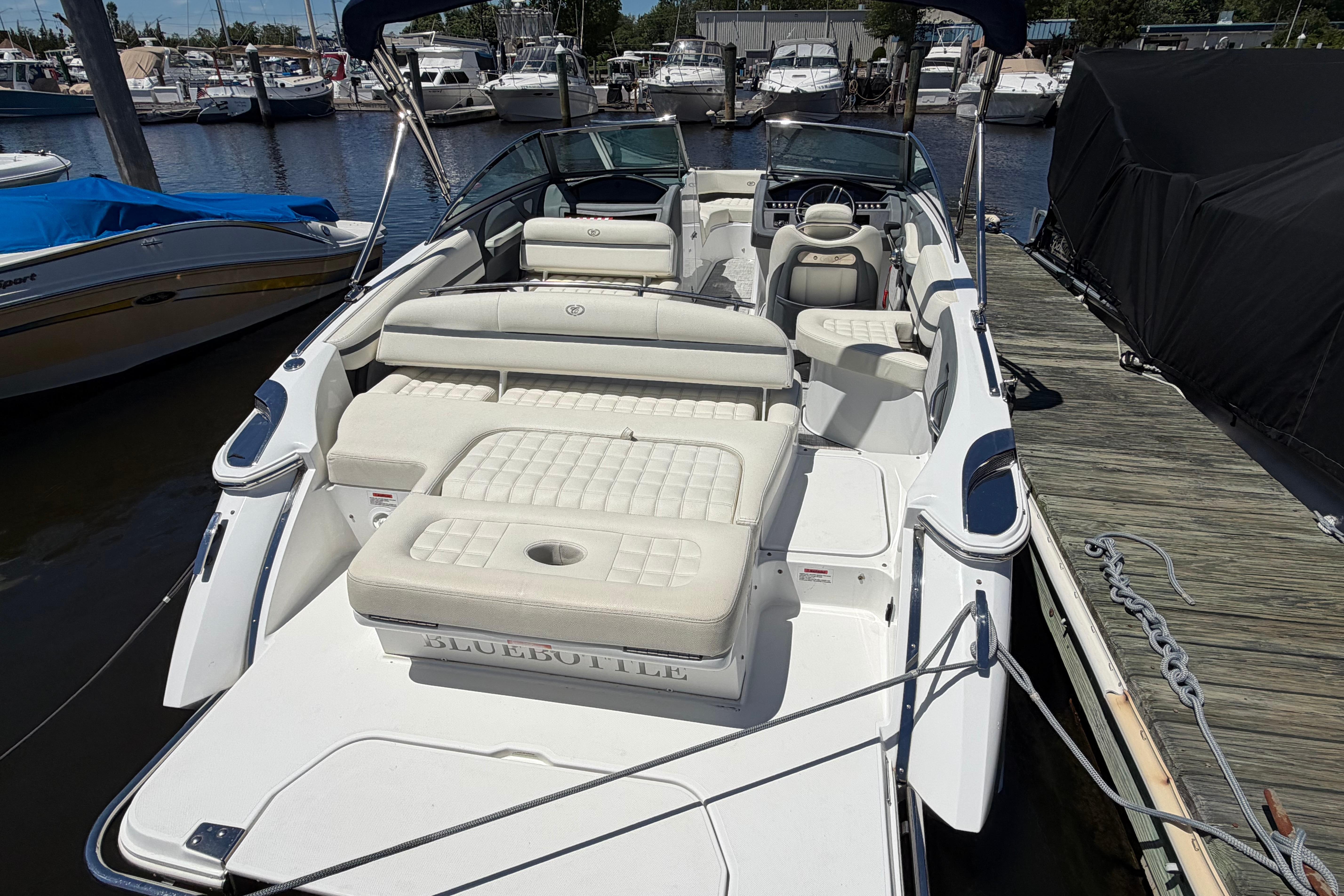 2020 Cobalt R3 boat docked, featuring spacious seating and sleek design.