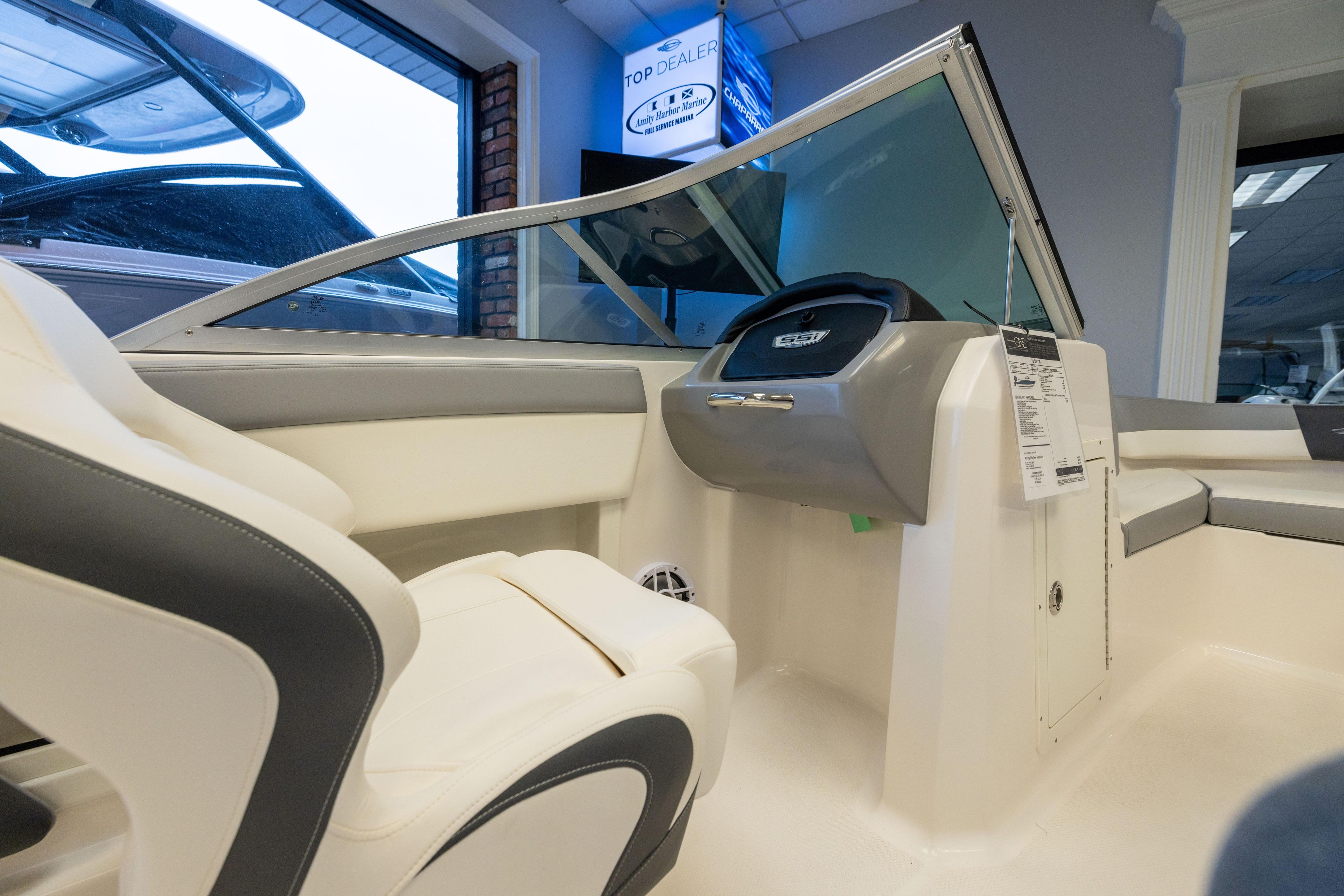 2024 Chaparral 19 SSi OB boat interior with sleek seating and modern dashboard design.