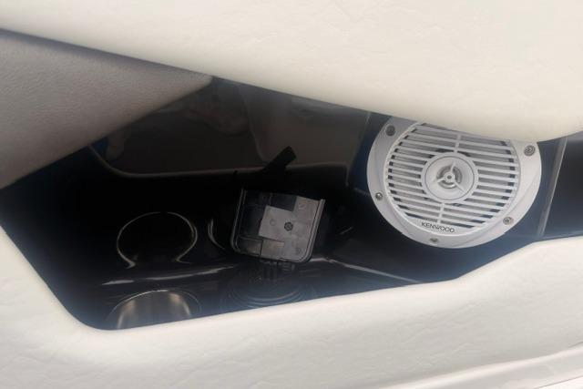 Speaker and cup holders in a 2007 Regal 2200 Bowrider boat interior.