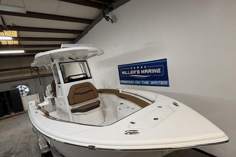 2026 Sea Pro 242 Center Console boat displayed indoors at Miller's Marine.