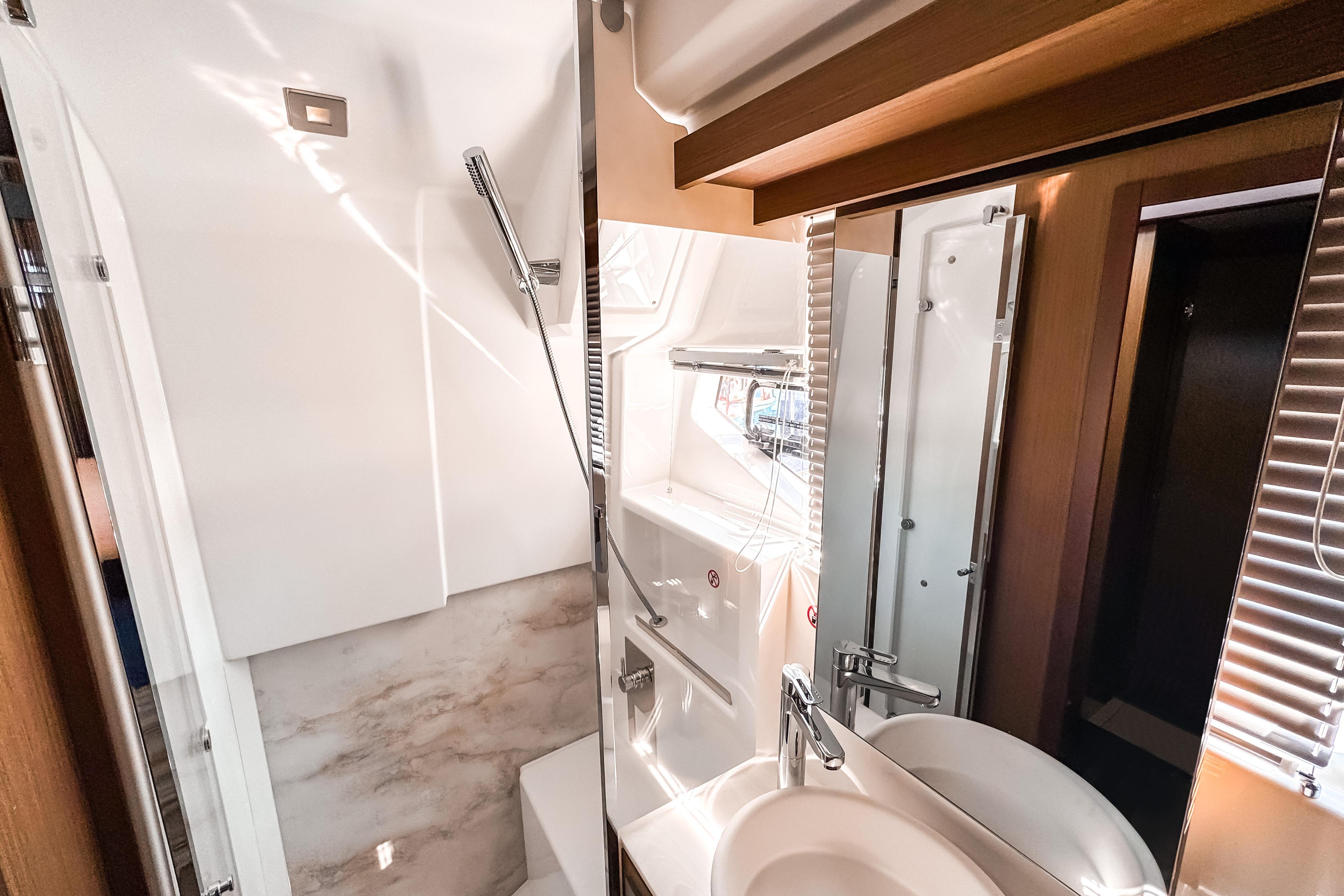 Luxurious bathroom interior of 2026 Wellcraft 44 Explorer yacht, featuring modern fixtures and elegant design.