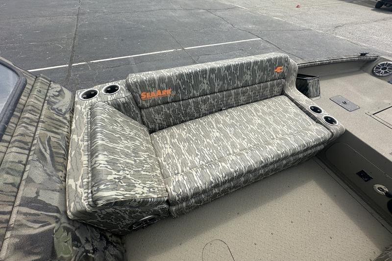 Camouflage seating on 2026 SeaArk EasyCat boat with cup holders.