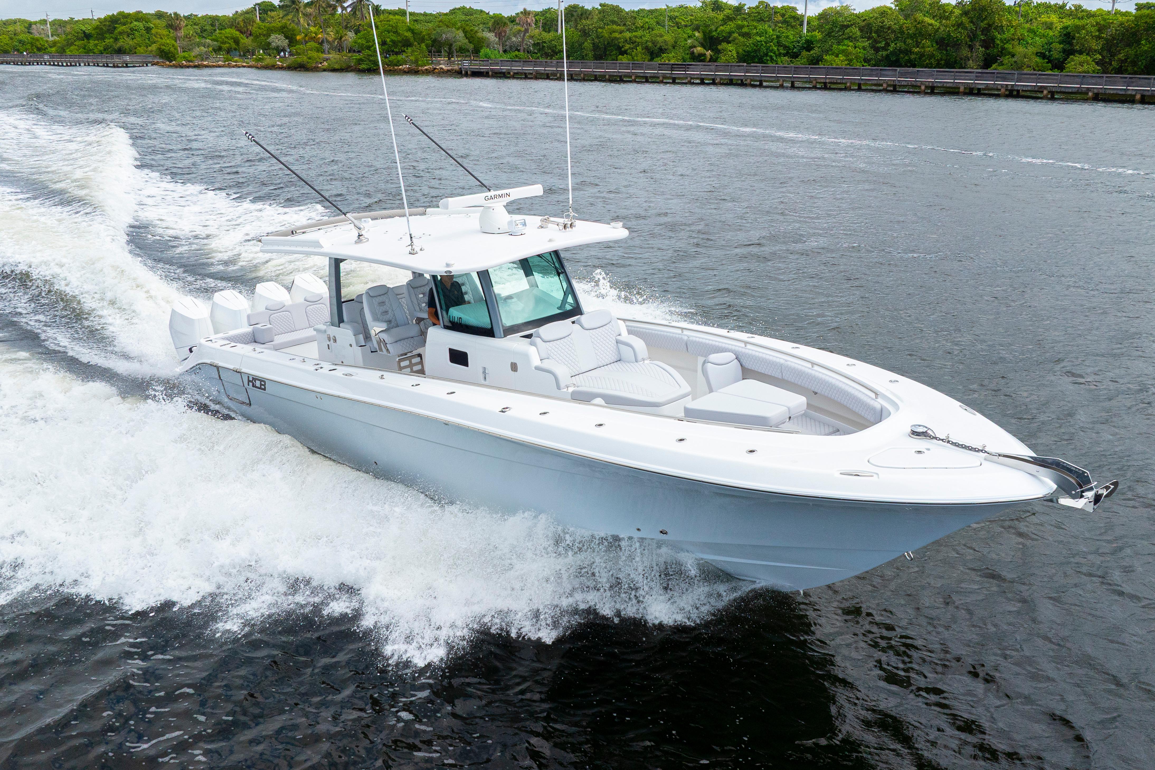 2026 HCB 42 Lujo boat cruising on a river, showcasing sleek design and powerful performance.
