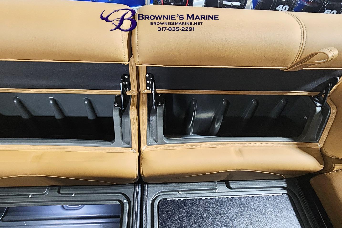Tan leather seating with storage compartments in a 2026 Regency 250 DL boat.
