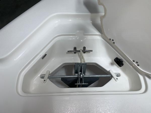 Anchor storage compartment on 2026 Key West 188 Bay Reef boat, featuring secure rope and latch.