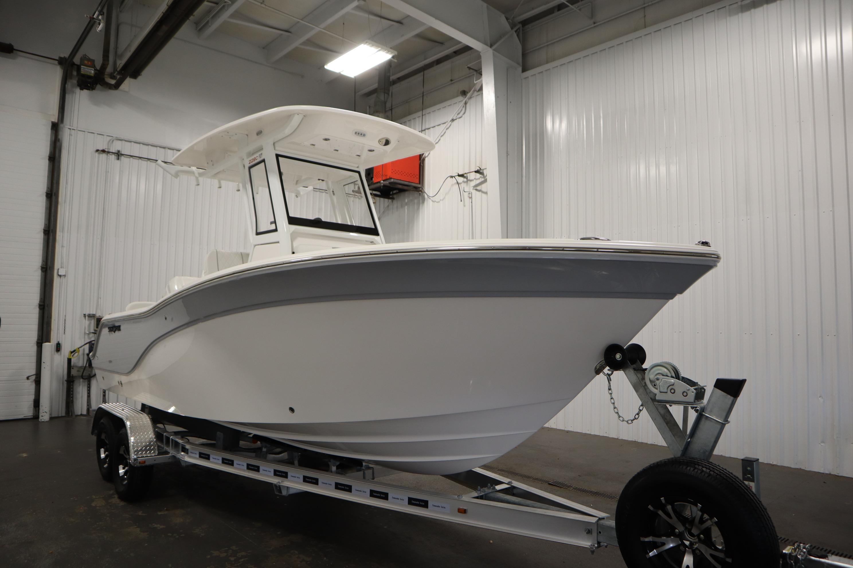 2026 Sea Fox 228 Commander boat on trailer in indoor storage facility.