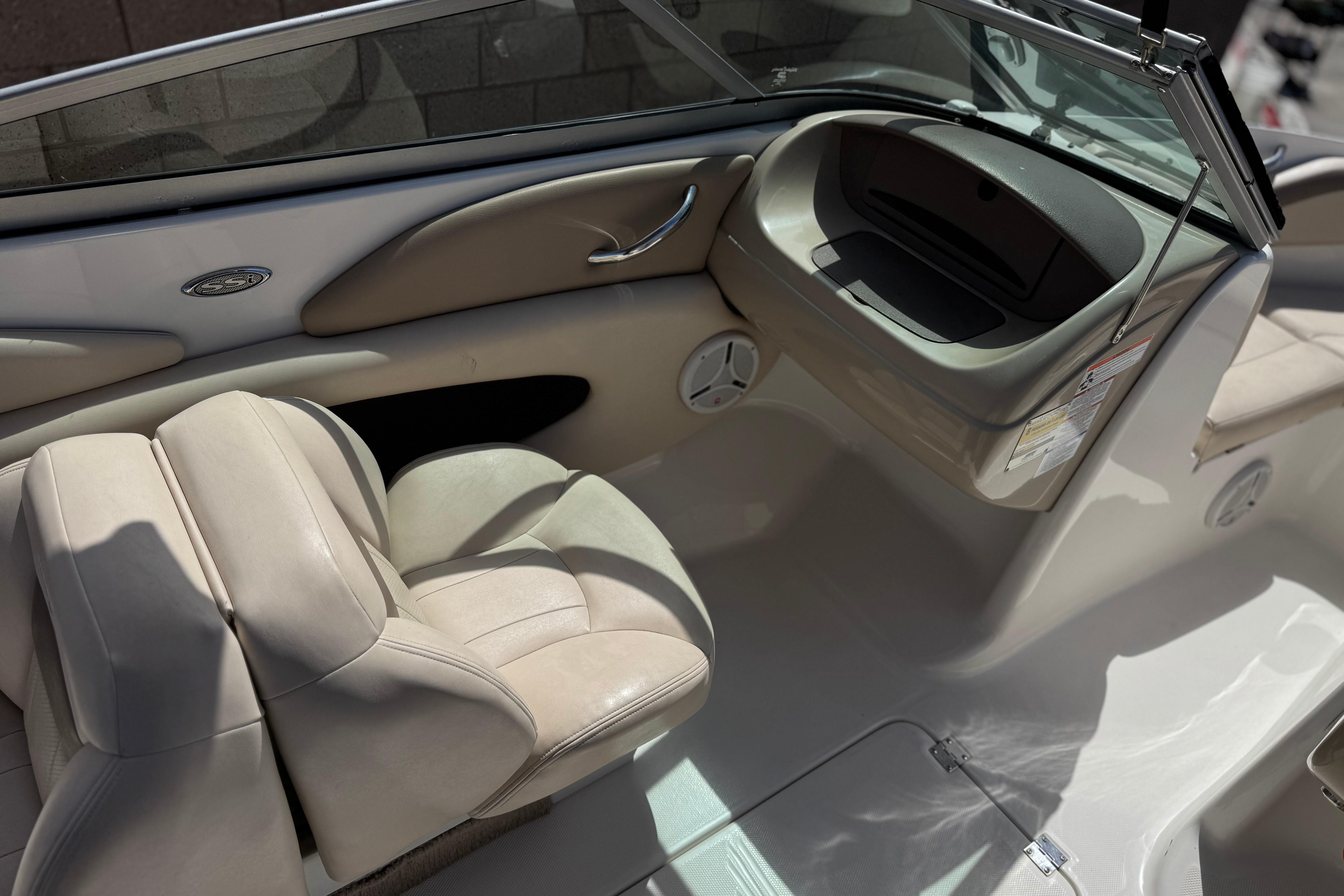 Interior of a 2006 Chaparral 190 SSi boat with beige seating and dashboard.