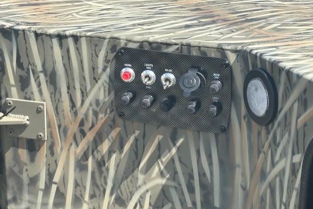 Control panel of 2026 Tracker Grizzly 1654 T Sportsman boat with camouflage design.