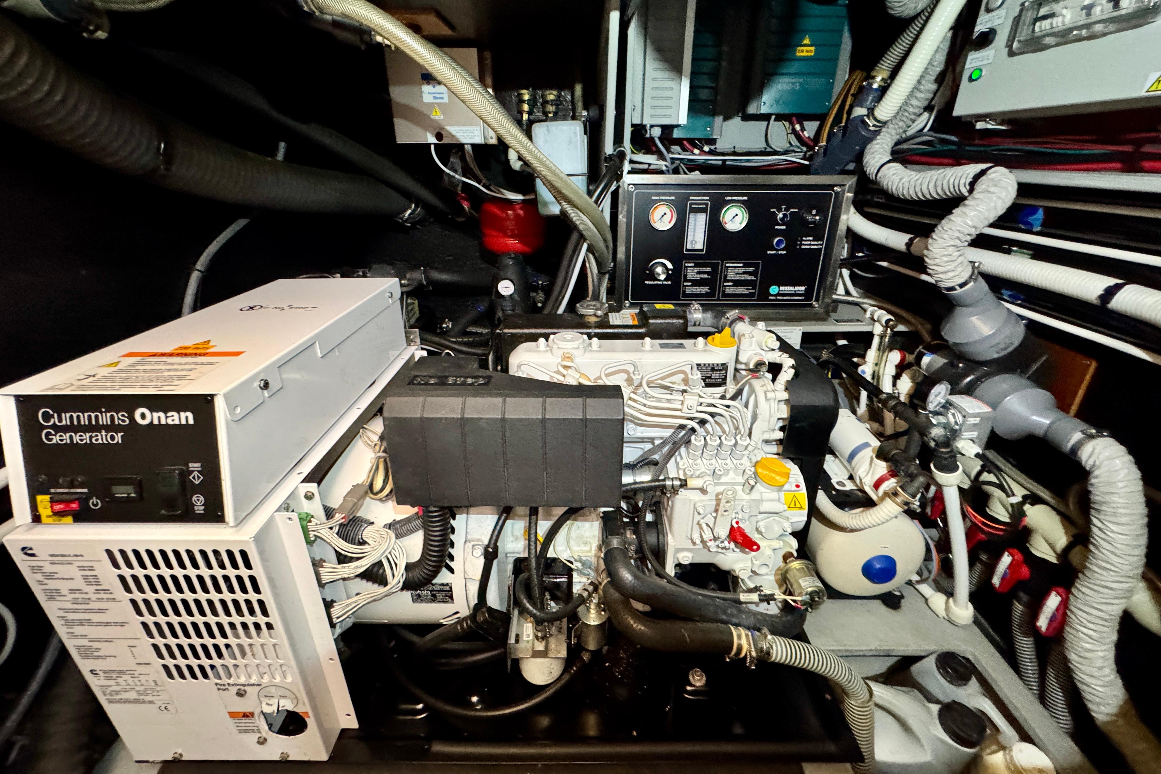 Engine room of 2015 Amel 55 yacht with Cummins Onan generator.