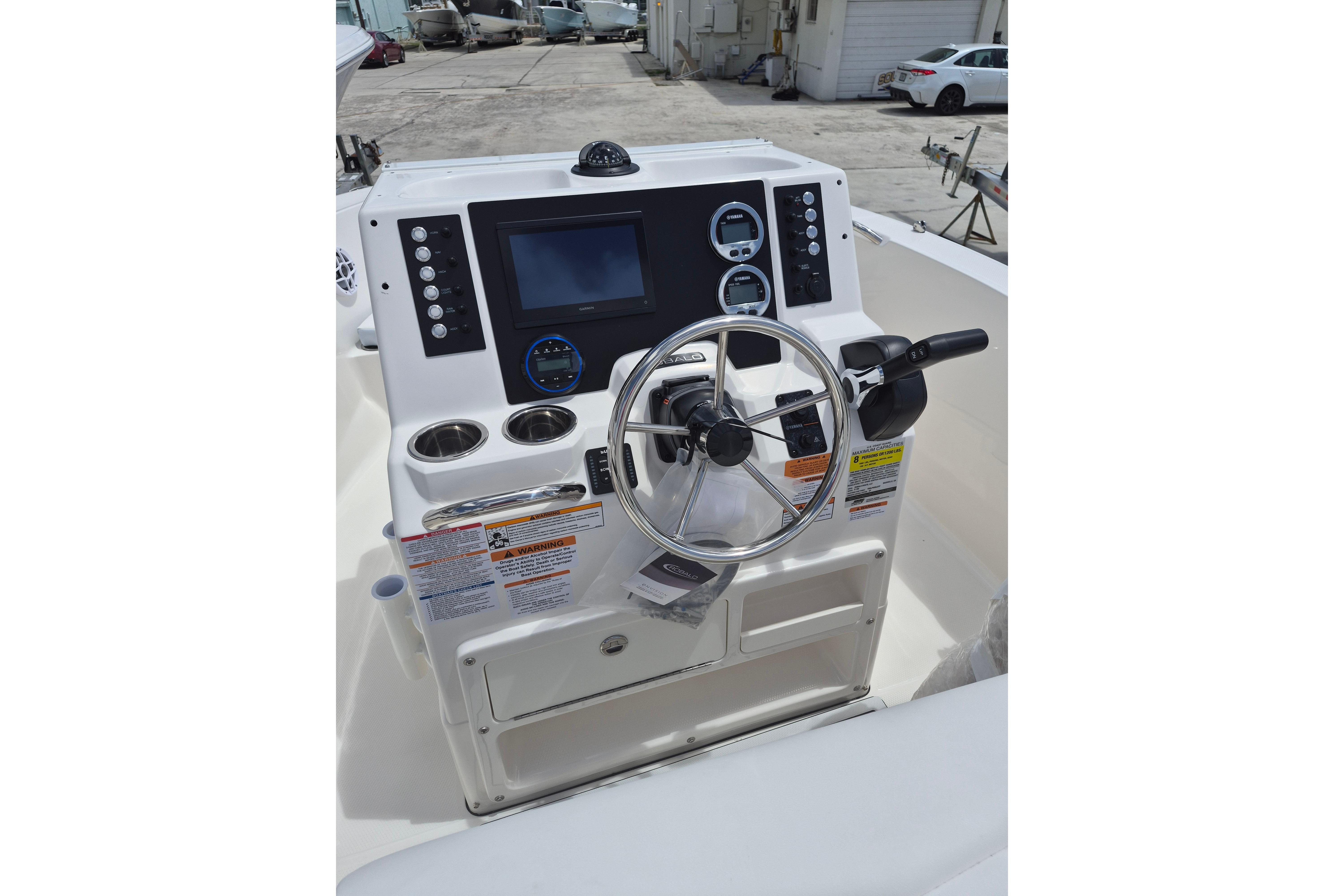 2026 Robalo R180 Center Console boat dashboard with steering wheel and control panel.