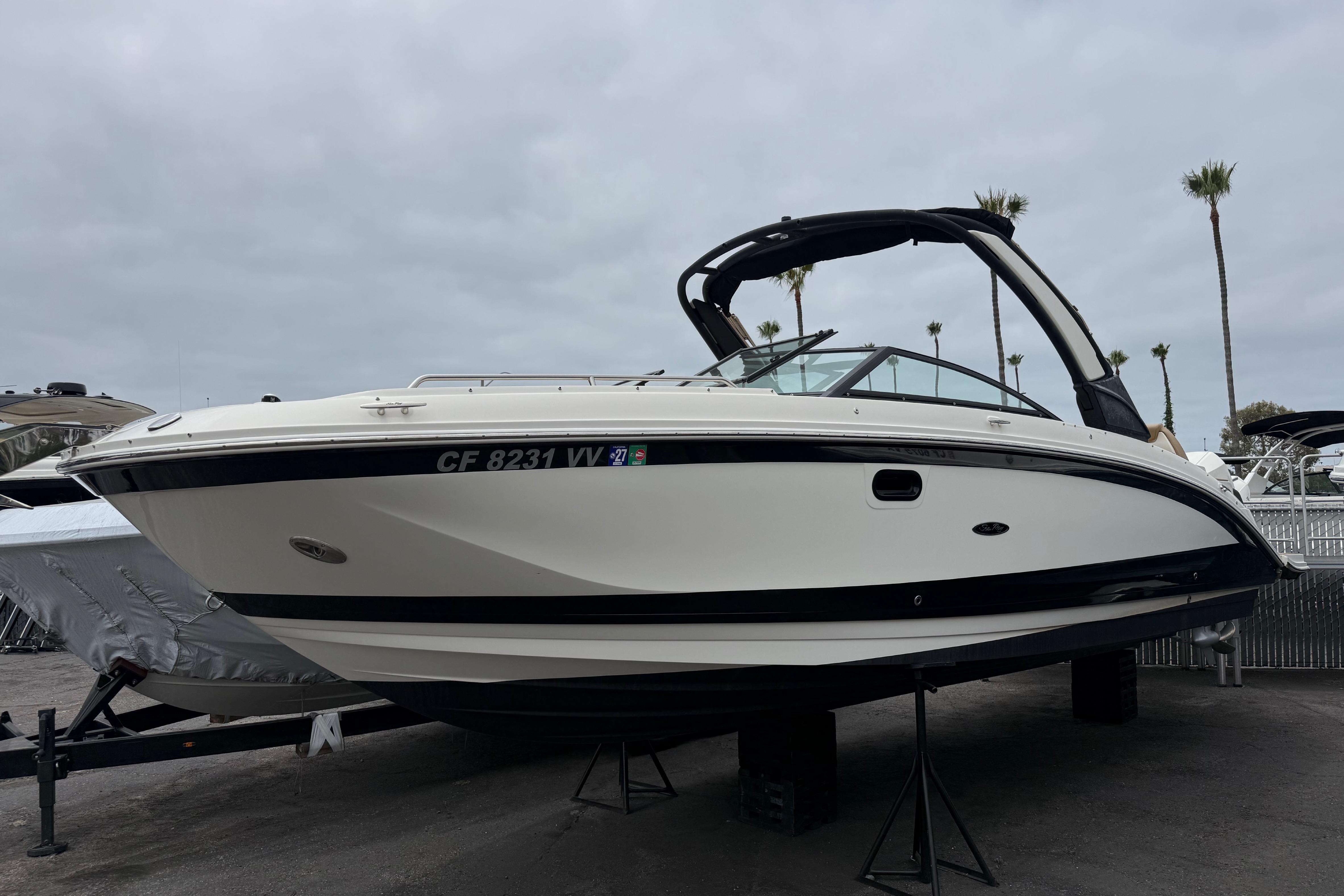 2022 Sea Ray SDX 290 Outboard boat displayed outdoors on a cloudy day.
