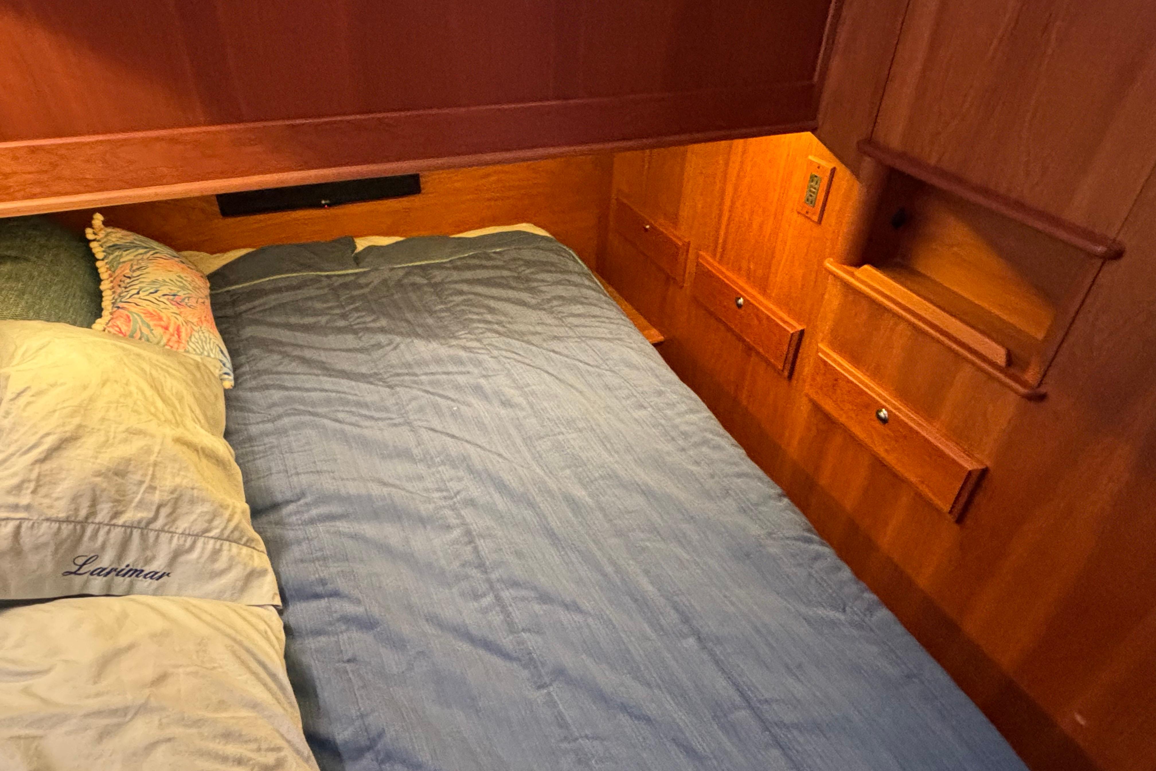 Cozy cabin bedroom in 2019 Sabre 45 Salon Express yacht with wooden interior.