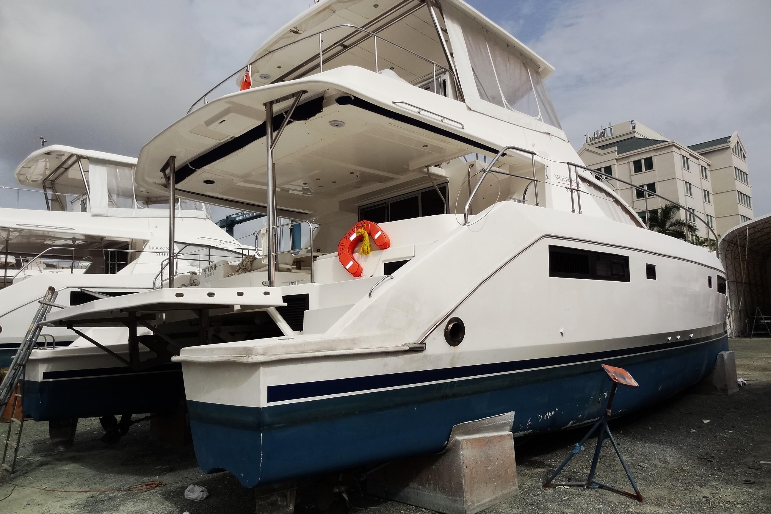 2016 Leopard 51 Powercat yacht on dry dock, showcasing sleek design and spacious deck.