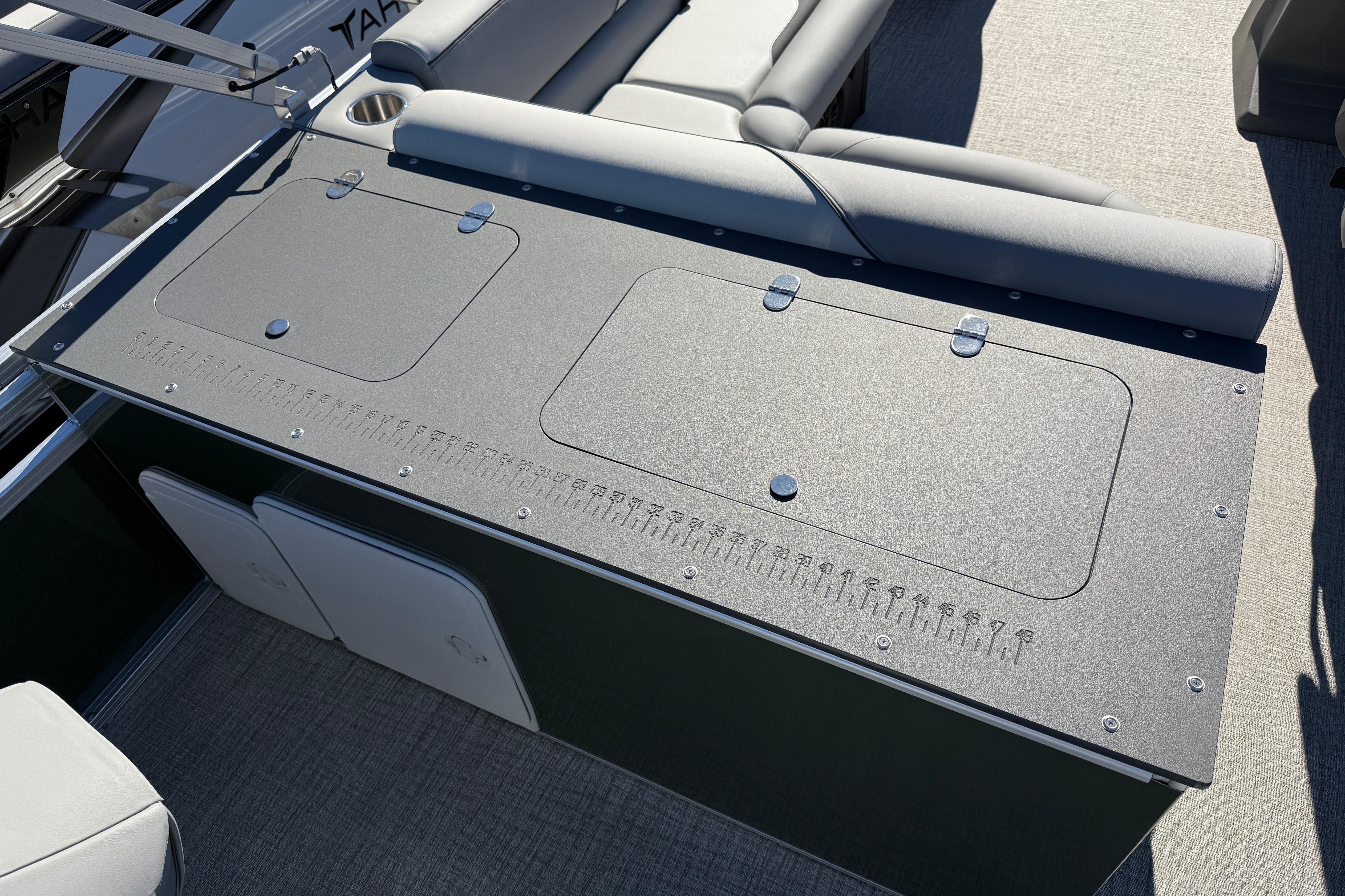 2026 Tahoe Pontoon Sport 85 Rear Fish boat with seating and storage compartments.