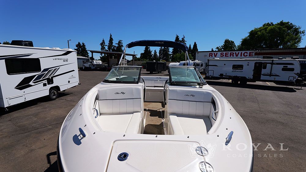 2014 Sea Ray SLX 230 on a lot with RVs in the background.