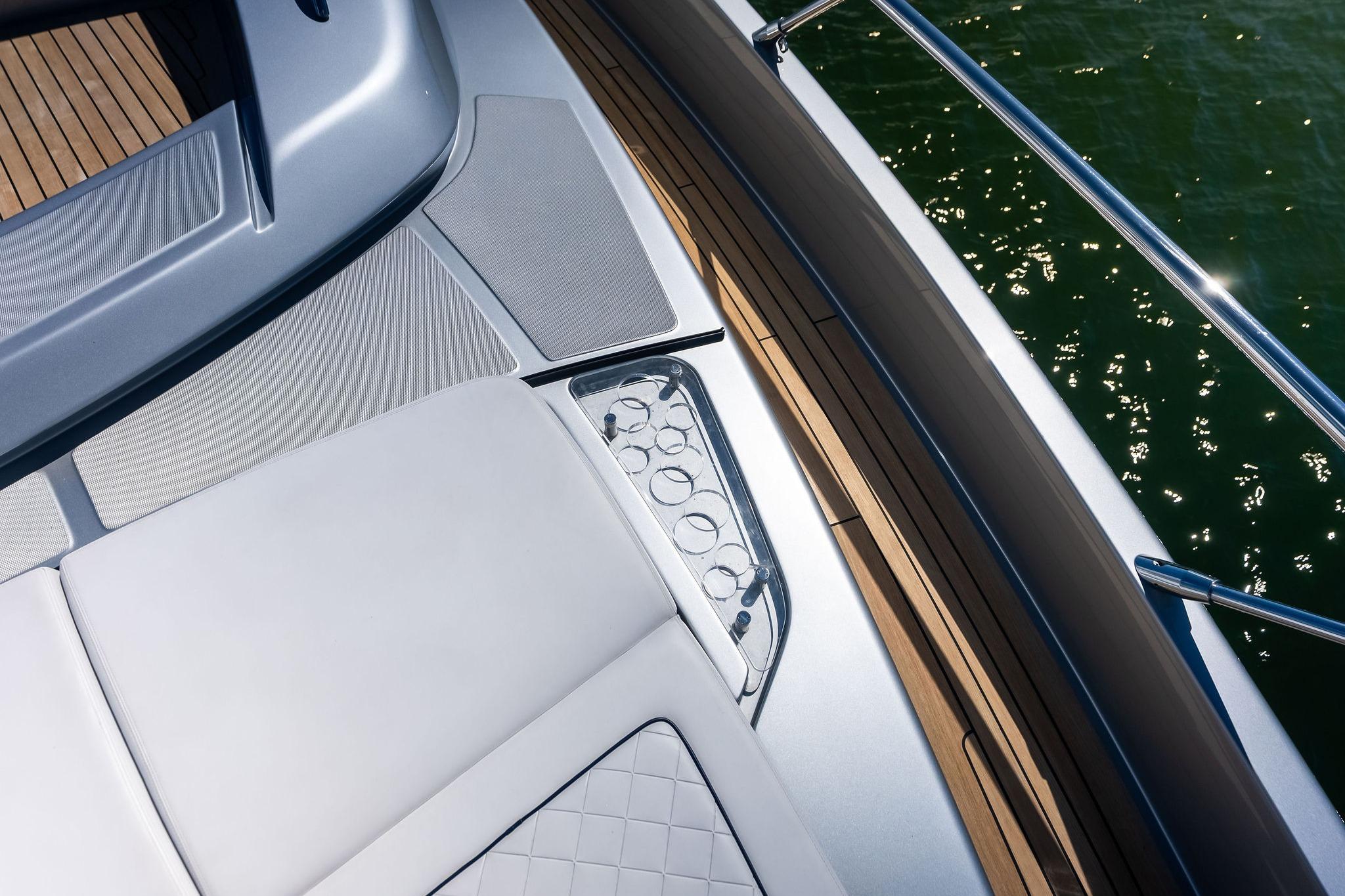 Luxurious deck of 2023 Riva 76 PERSEO Super yacht with elegant seating and cup holders.