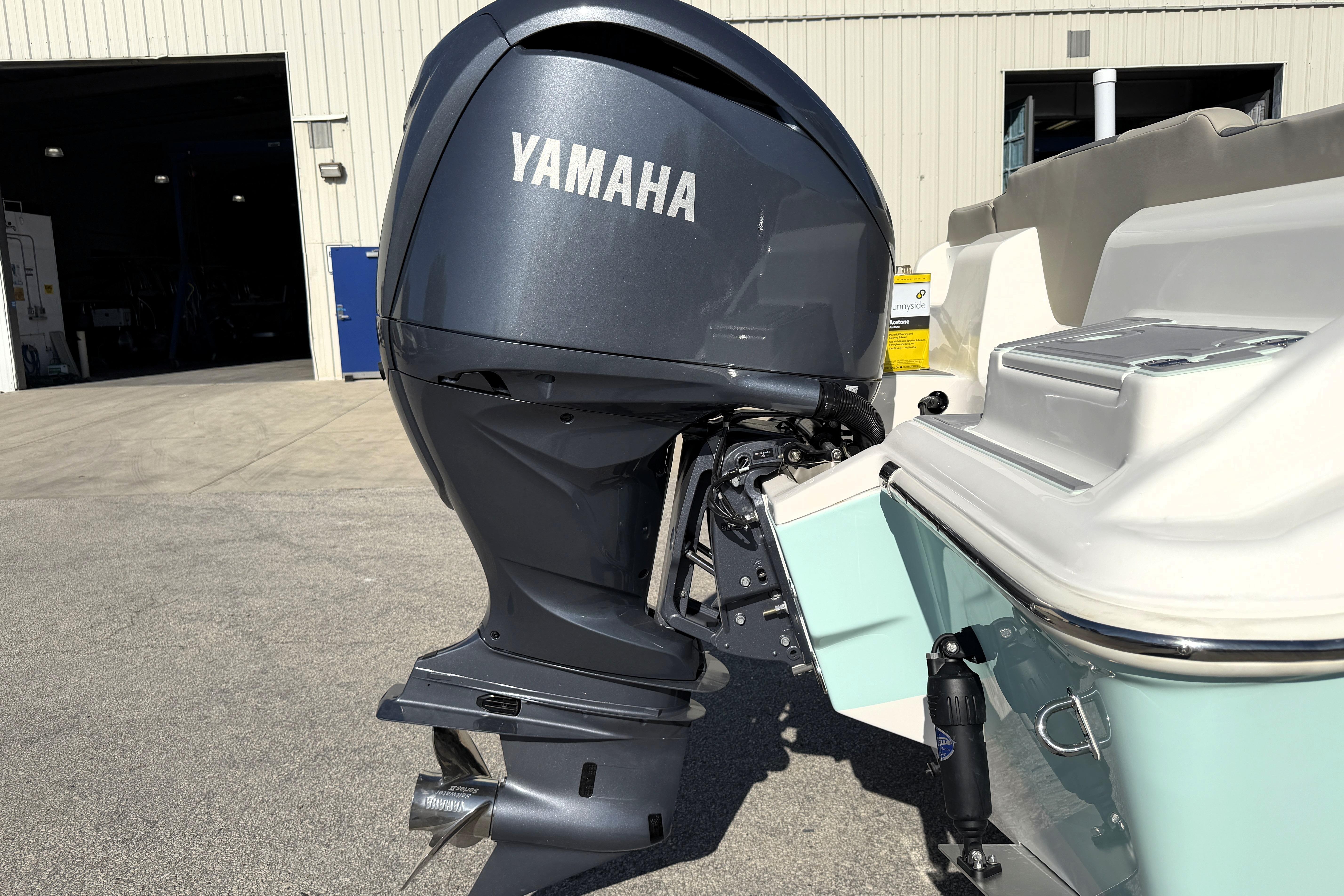 2025 Key West 239 FS boat with Yamaha outboard motor in a marina setting.