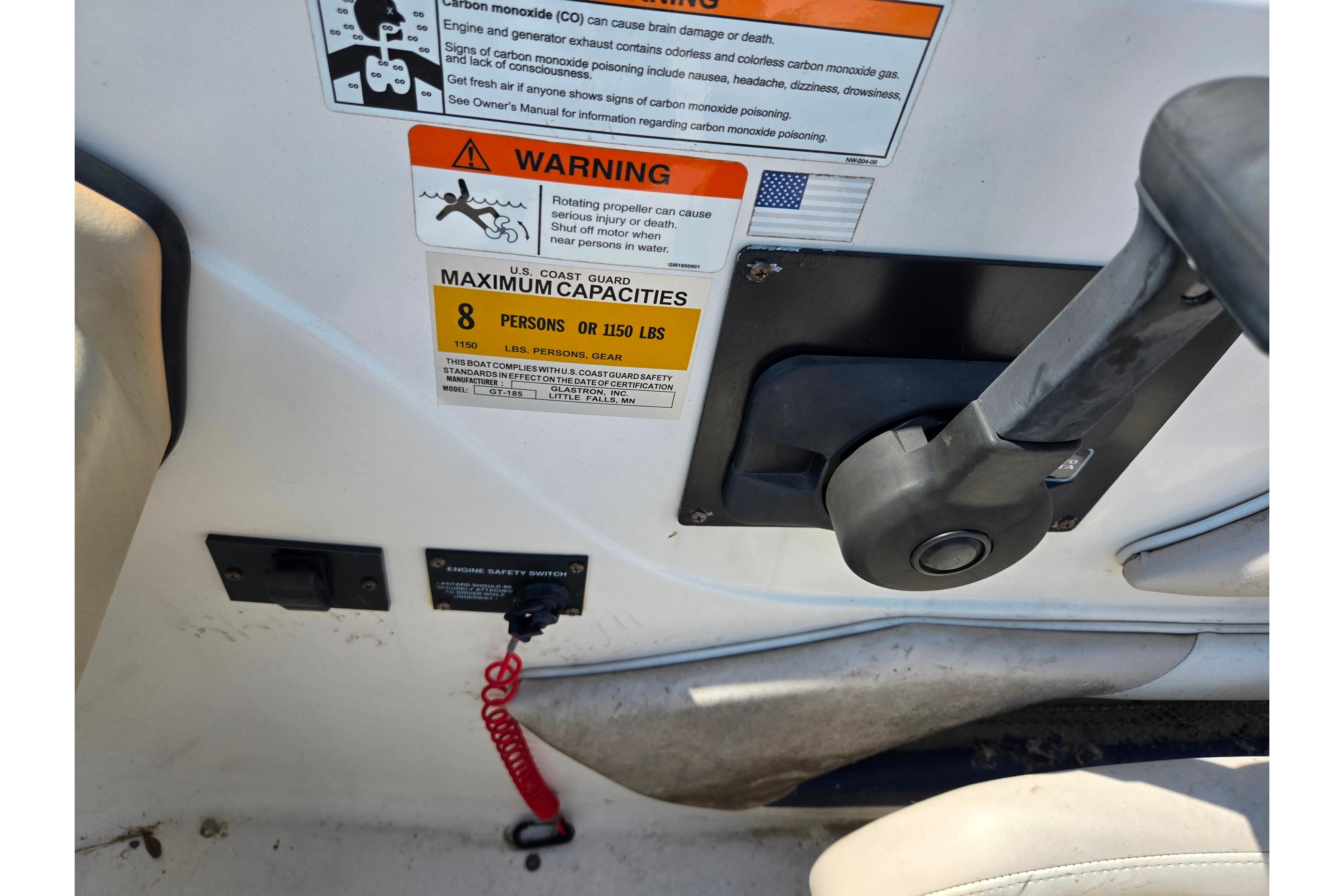 2007 Glastron GT 185 boat control panel with safety warnings and capacity details.